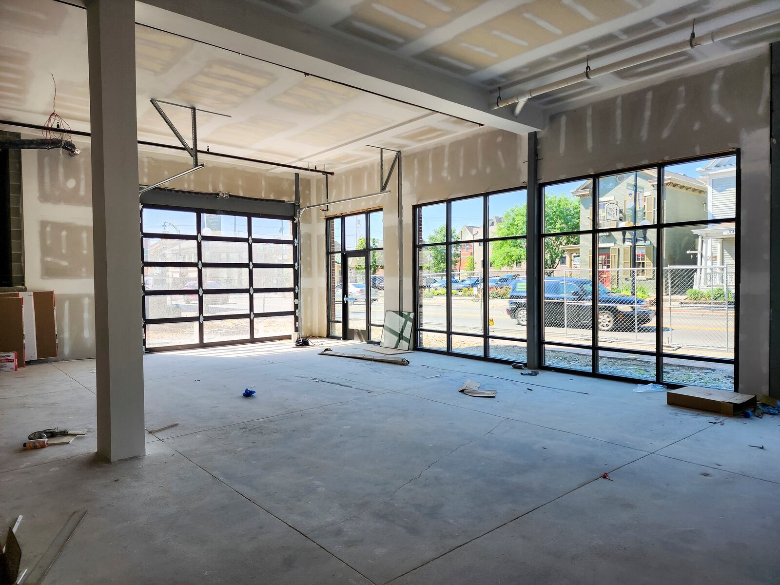 Construction continues on the Rossville Flats apartments with street-level retail space on Main Street in Hamilton. This is one of two dining or retail spaces. NICK GRAHAM/STAFF