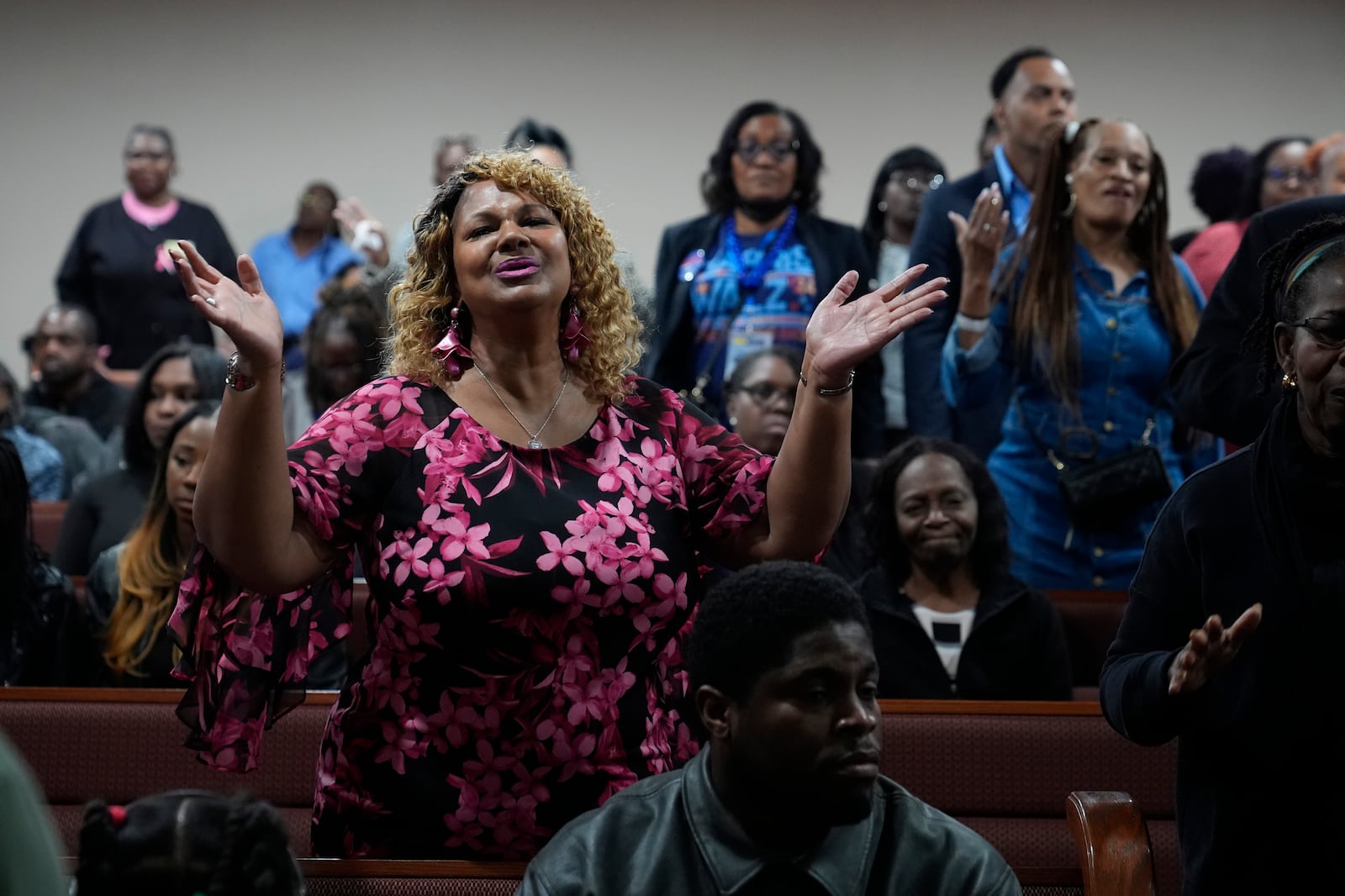 Members of the congregation pray before Democratic presidential nominee Vice President Kamala Harris arrives to speak during a service at the Church of Christian Compassion, Sunday, Oct. 27, 2024. (AP Photo/Susan Walsh)