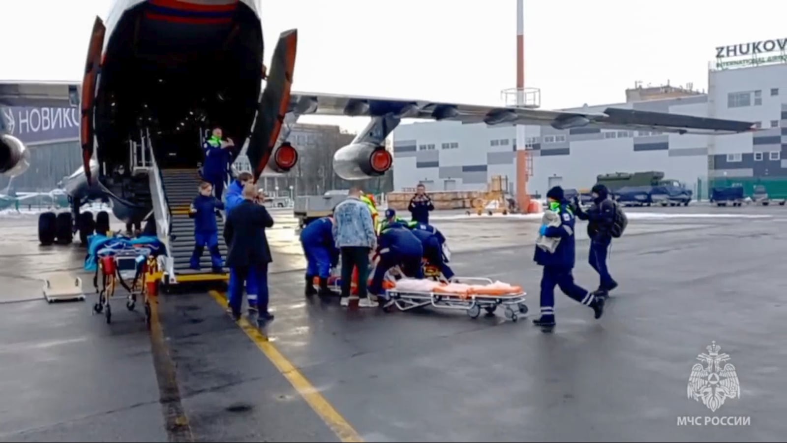 In this image taken from video released by the Russian Emergency Ministry Press Service, rescuers transport wounded passengers from a medical plane after the Azerbaijani Airline crashed, near the Kazakhstani city of Aktau, upon their arrival at the Zhukovsky airport outside Moscow, Russia, on Thursday, Dec. 26, 2024. (Russian Emergency Ministry Press Service via AP)