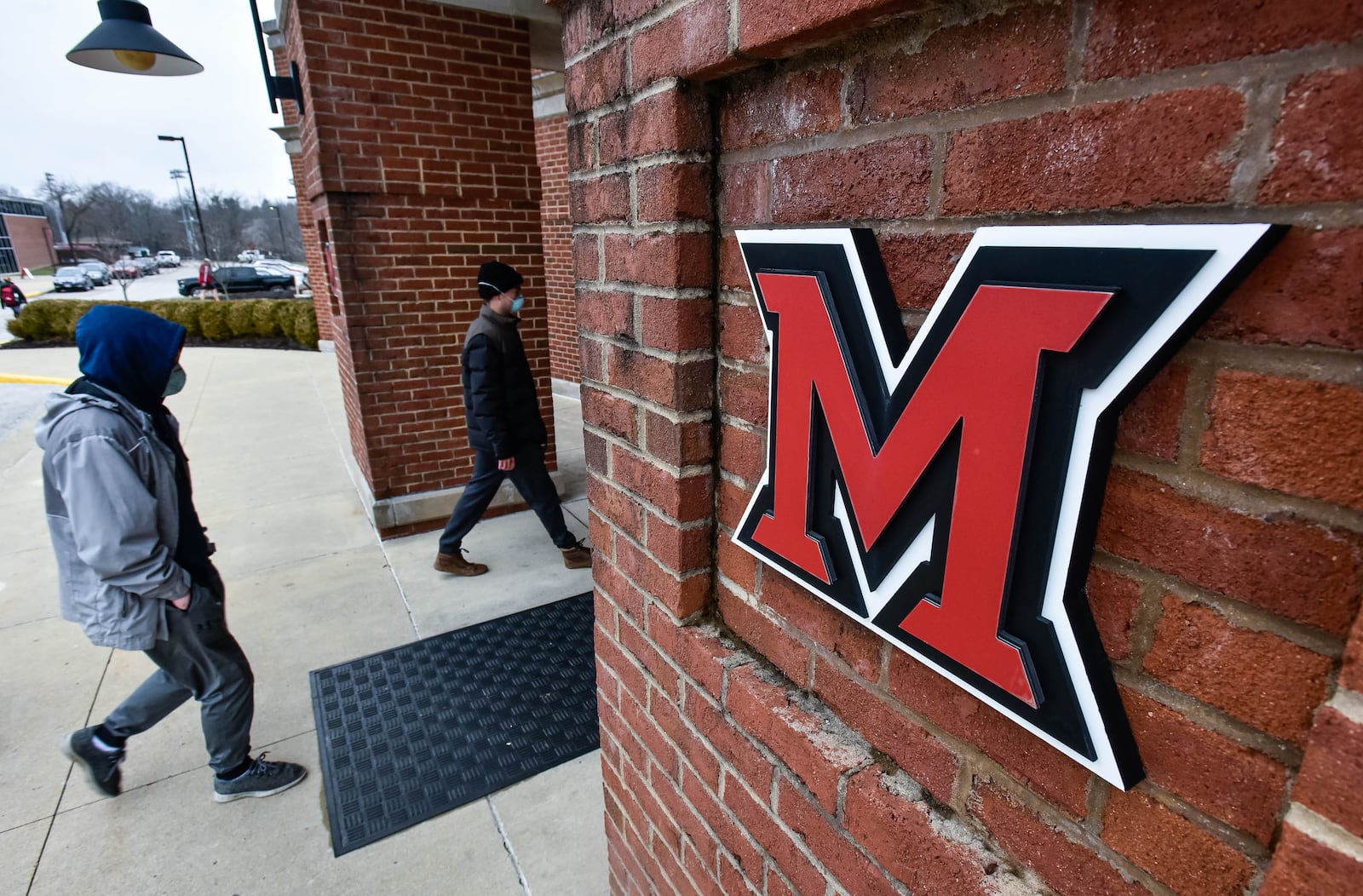 Miami University students wearing face masks as a precautionary measure were visible on campus Tuesday, Jan. 28, 2020 in Oxford. Miami University held a press conference regarding two possible cases of coronavirus in students who recently returned back from China. The cases are not confirmed but precautions are being taken. NICK GRAHAM / STAFF