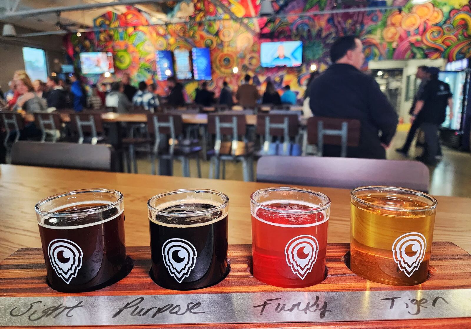 Third Eye Brewing held a VIP private event showing off their new brewery and restaurant on Dixie Highway in Hamilton Tuesday, Nov. 14, 2023. The wood used to make the flight boards was salvaged from the building during construction. NICK GRAHAM/STAFF