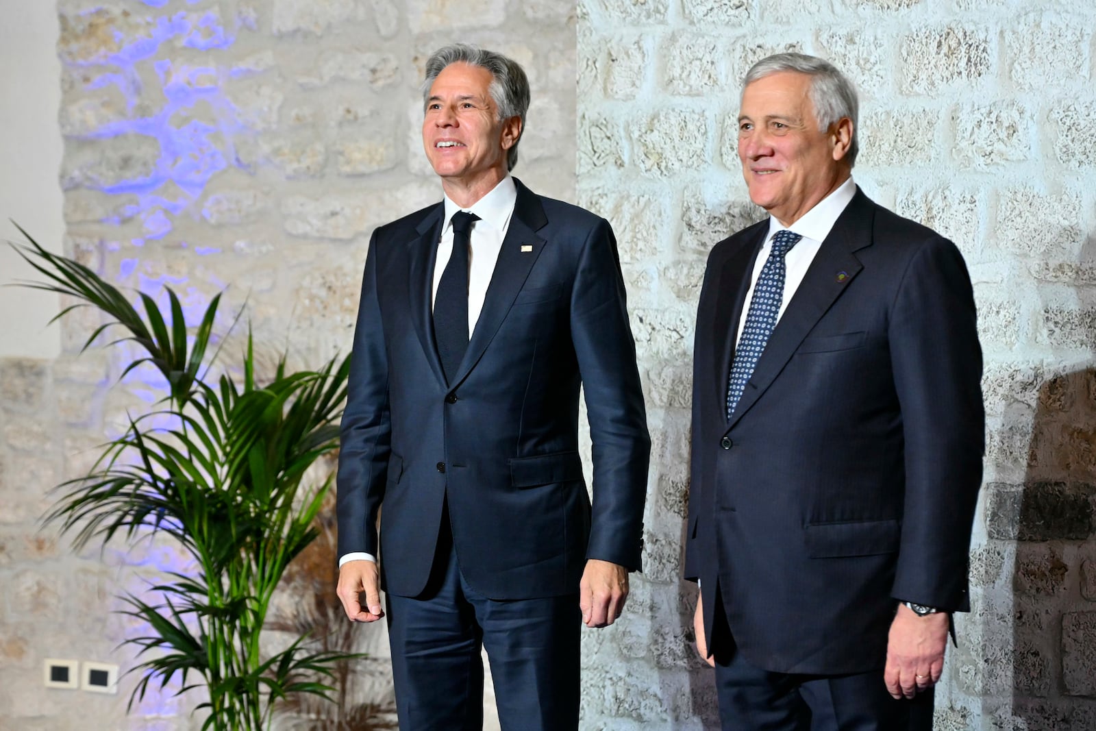 Italy's Foreign Minister Antonio Tajani, right, welcomes U.S. Secretary of State Antony Blinken at the G7 Foreign Ministers meeting in Anagni, central Italy, Monday, Nov. 25, 2024. (Andreas Solaro/Pool Photo via AP)