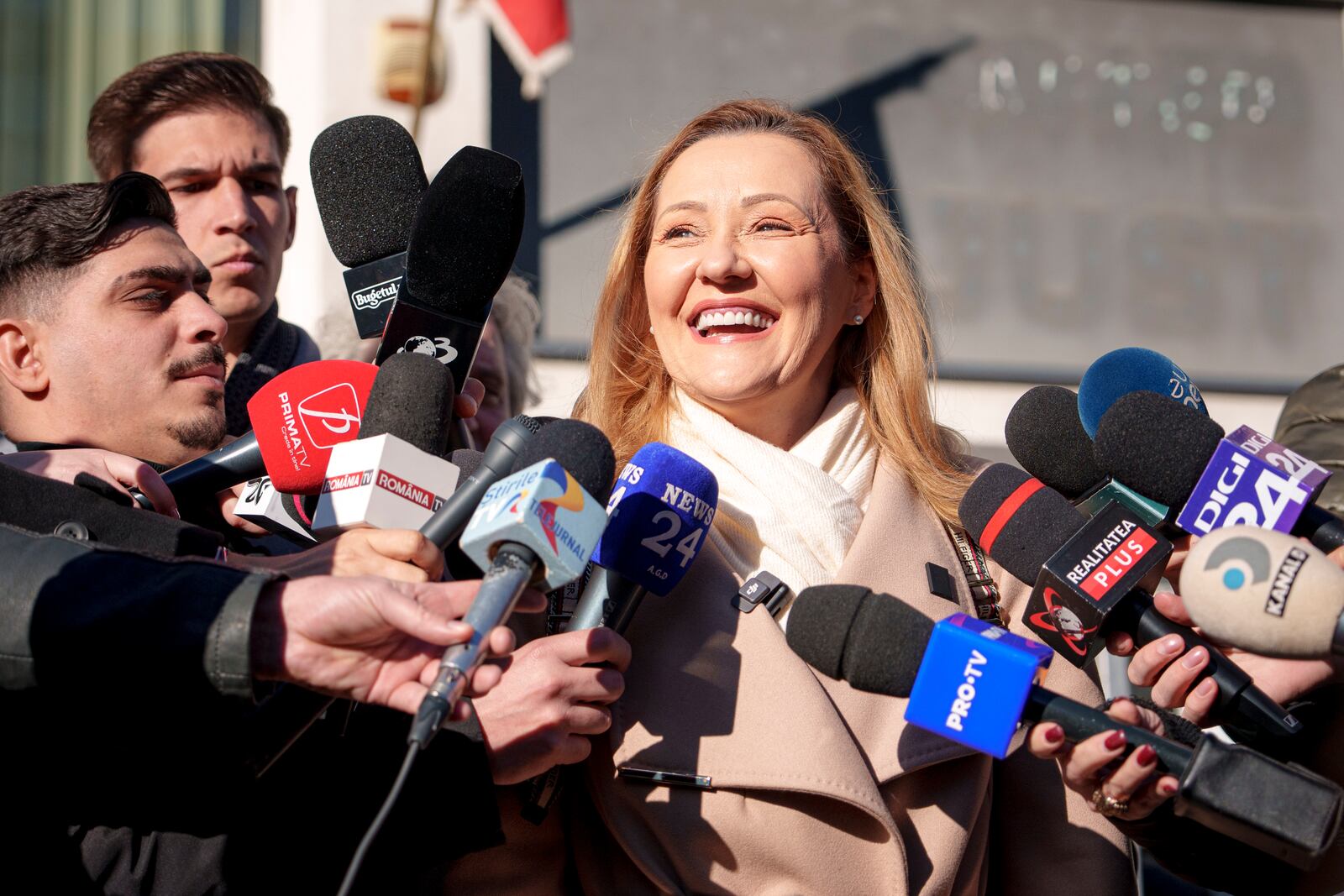 Elena Lasconi, the Save Romania Union (USR) party candidate for president, talks to media after casting her vote in the country's presidential elections, in Bucharest, Romania, Sunday, Nov. 24, 2024. (AP Photo/Andreea Alexandru)