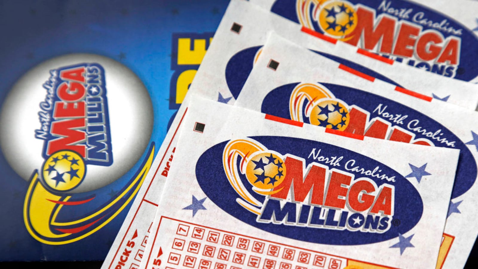 This 2016 file photo shows Mega Millions lottery tickets on a counter. After nearly three months without a winner, the Mega Millions lottery game has climbed to an estimated $654 million jackpot.