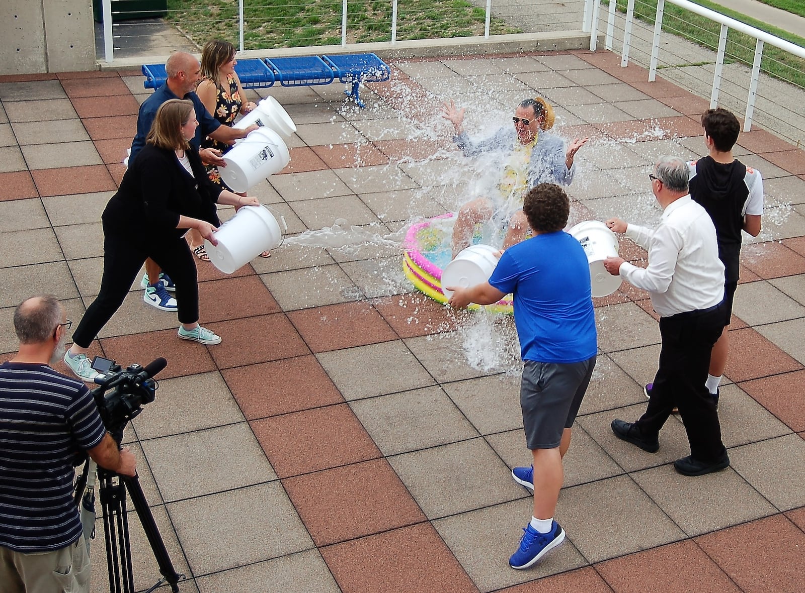 Staff and volunteers at the Fitton Center splatter Executive Director Ian MacKenzie-Thurley with buckets of water during a July 26 shoot to create a promotional video for the local arts center’s Season Launch Summer Party Aug. 19. TVHamilton shot and edited the video, which debuted Aug. 1. It’s available on both the Fitton Center and TVHamilton’s websites and social media channels. CONTRIBUTED