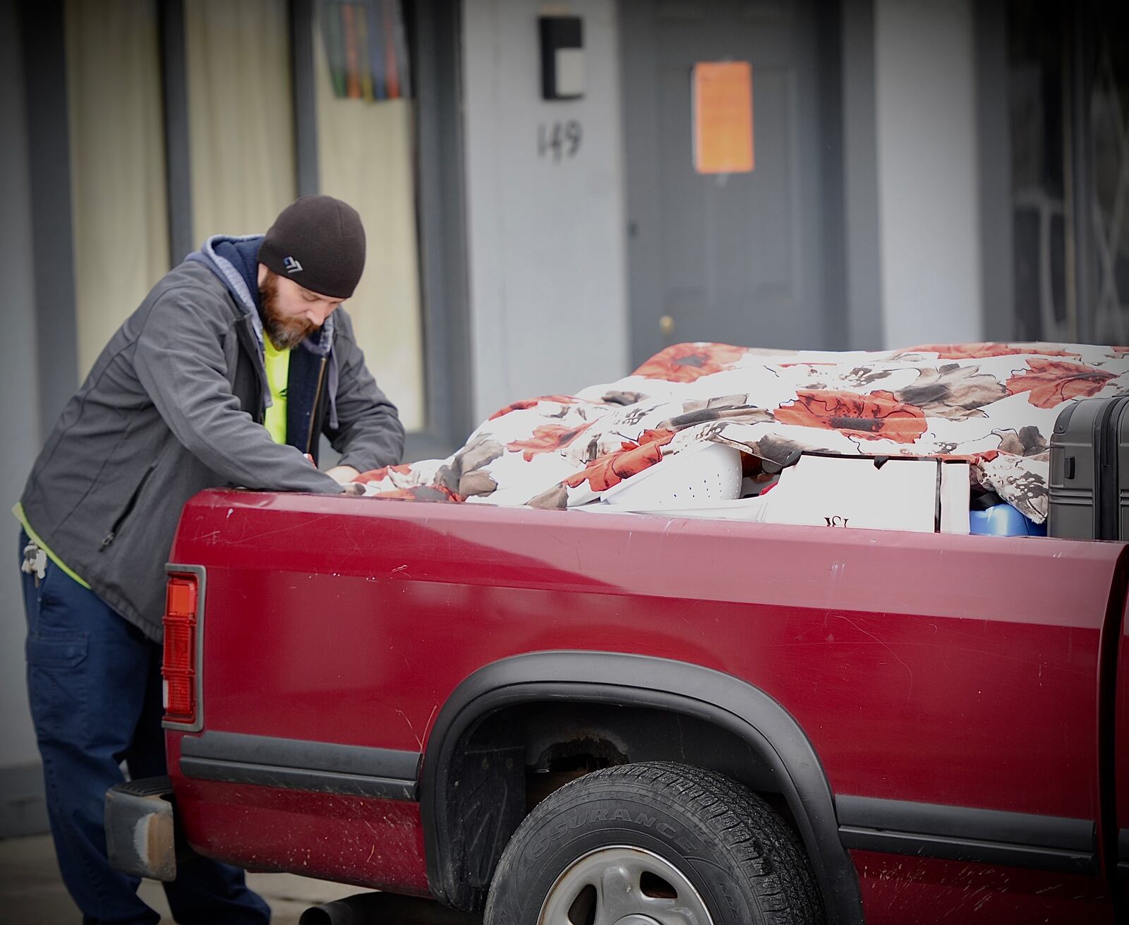 Joshua Hilligas packs his belongings into his truck after getting home from work and being forced out of the Rodeway Inn on Byers Road Monday, Oct. 31, 2023. The city of Miamisburg cited problems with drugs and crime at the site. Hilligas said he's been there two months and hasn't seen many problems of that type. MARSHALL GORBY / STAFF