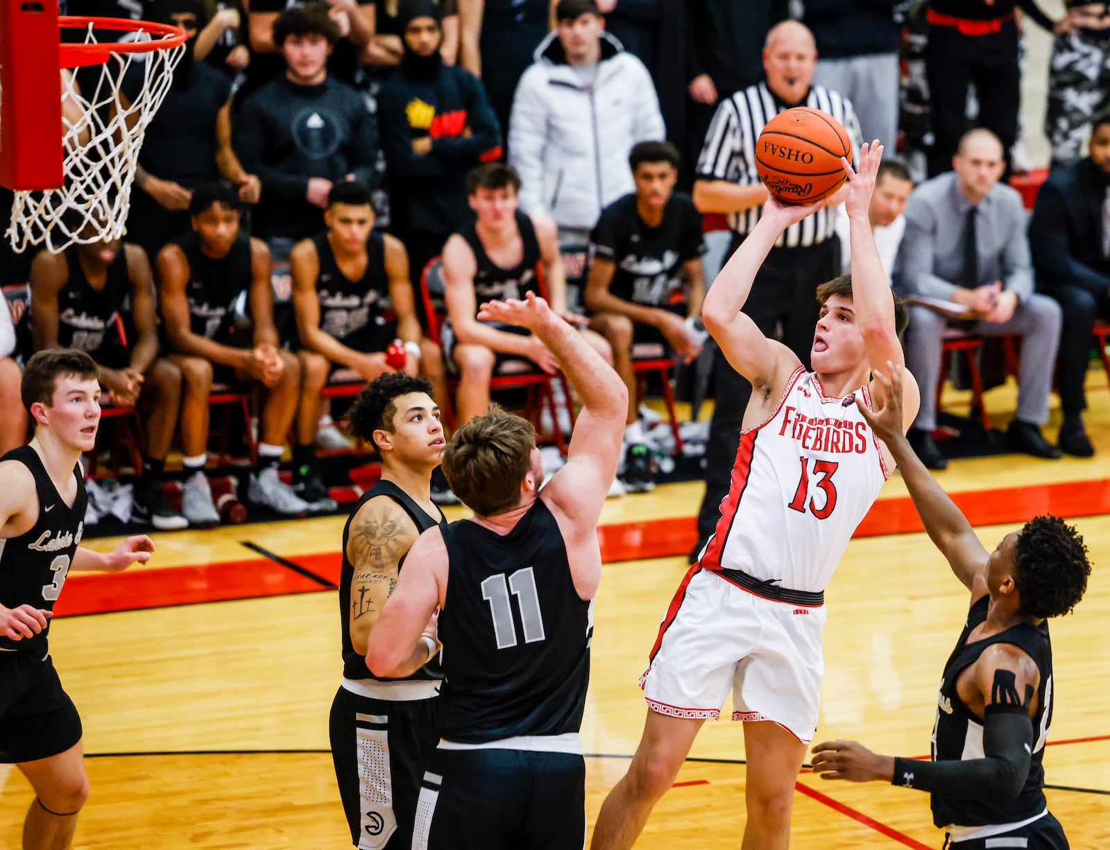 Lakota West's Nathan Dudukovich puts up a shot during their basketball game against Lakota East Friday, Dec. 17, 2021 at Lakota West High School in West Chester Township. Lakota East won 70-64. NICK GRAHAM / STAFF