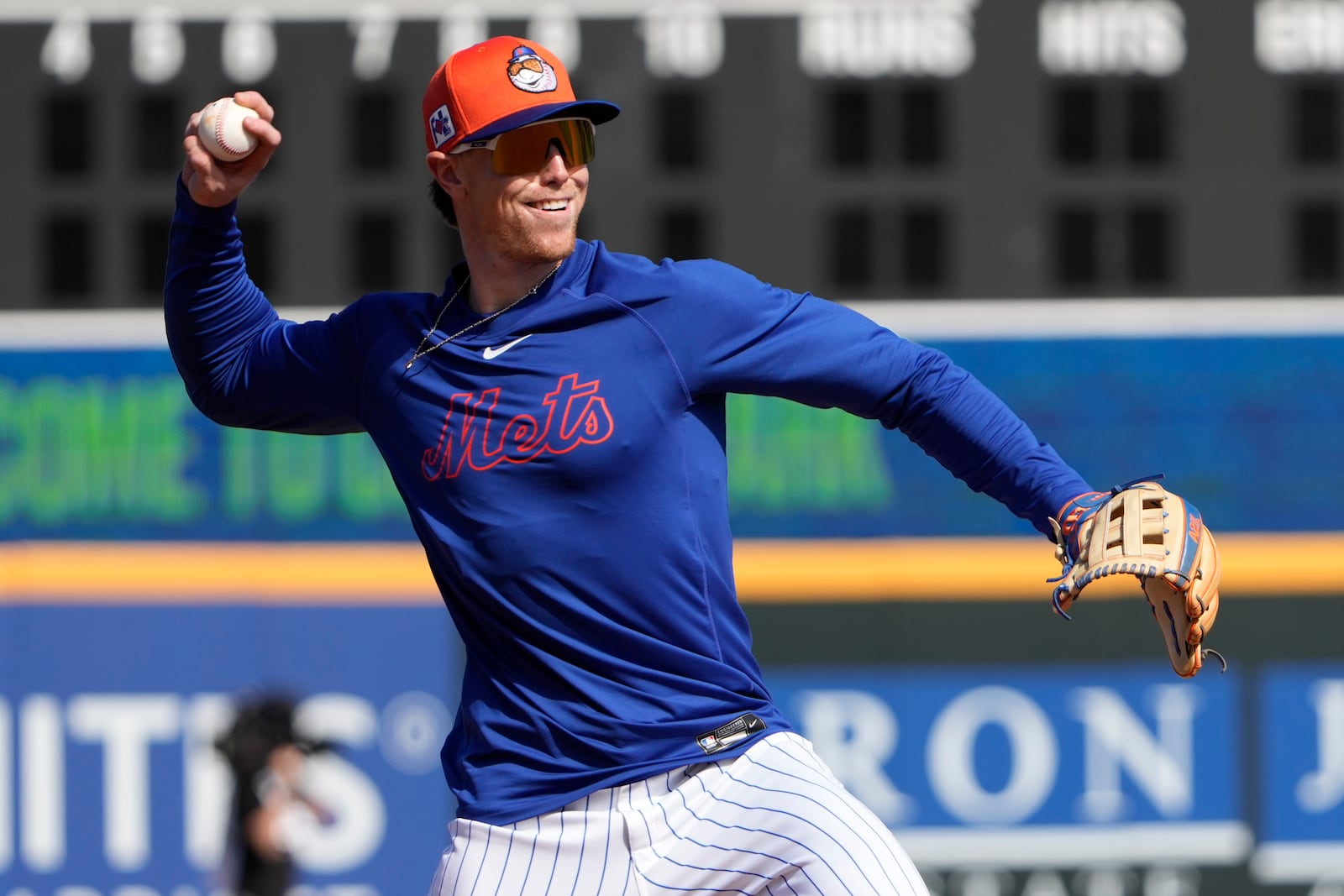 New York Mets' Brett Baty throws during a spring training baseball practice Monday, Feb. 17, 2025, in Port St. Lucie, Fla. (AP Photo/Jeff Roberson)