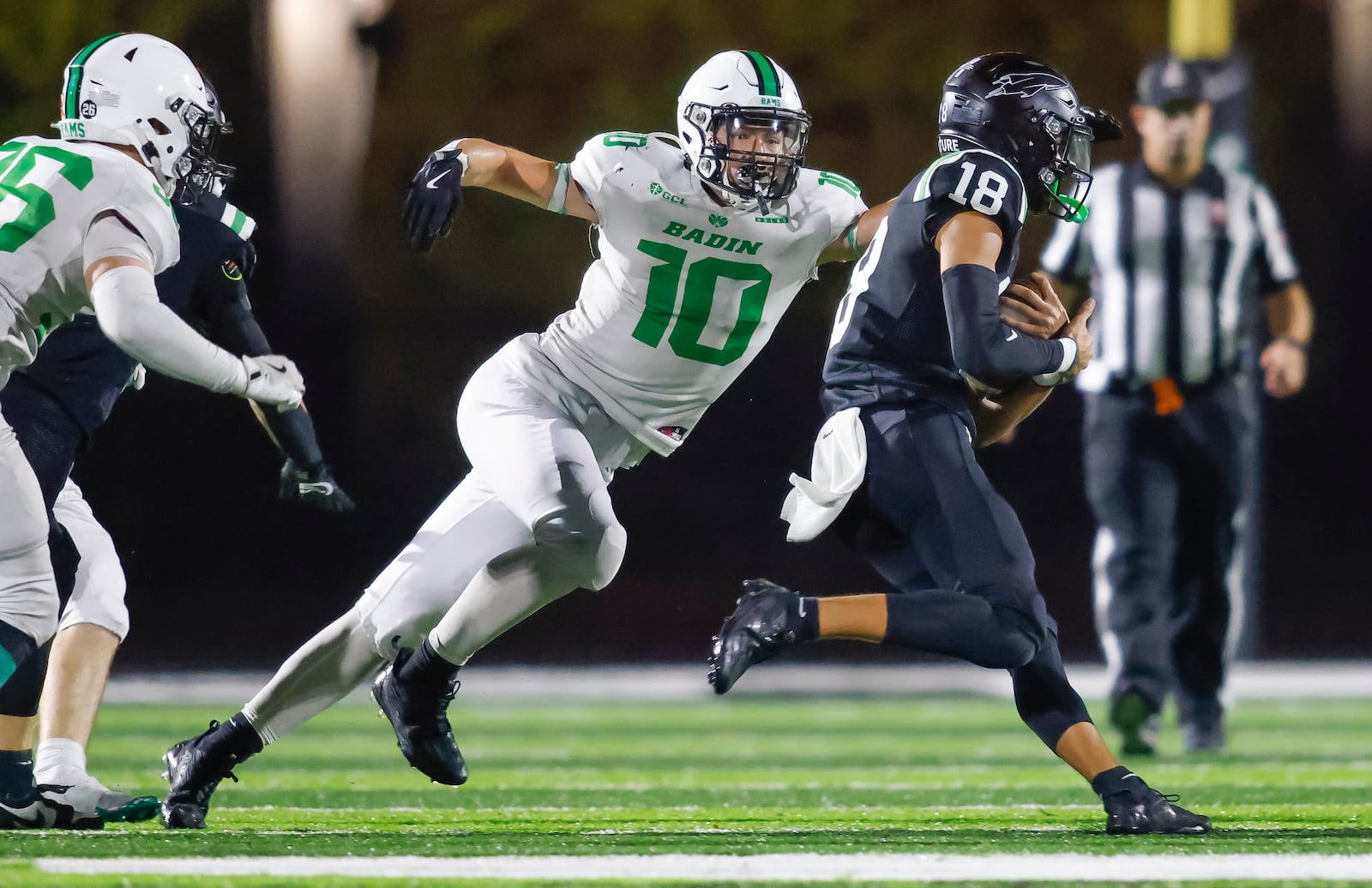 Badin's Alex Pate tackles McNicholas player Evan Sandfooss  during their football game Friday, Oct. 25, 2024 at McNicholas High School. Badin won 10-6 to win the GCL title. NICK GRAHAM/STAFF