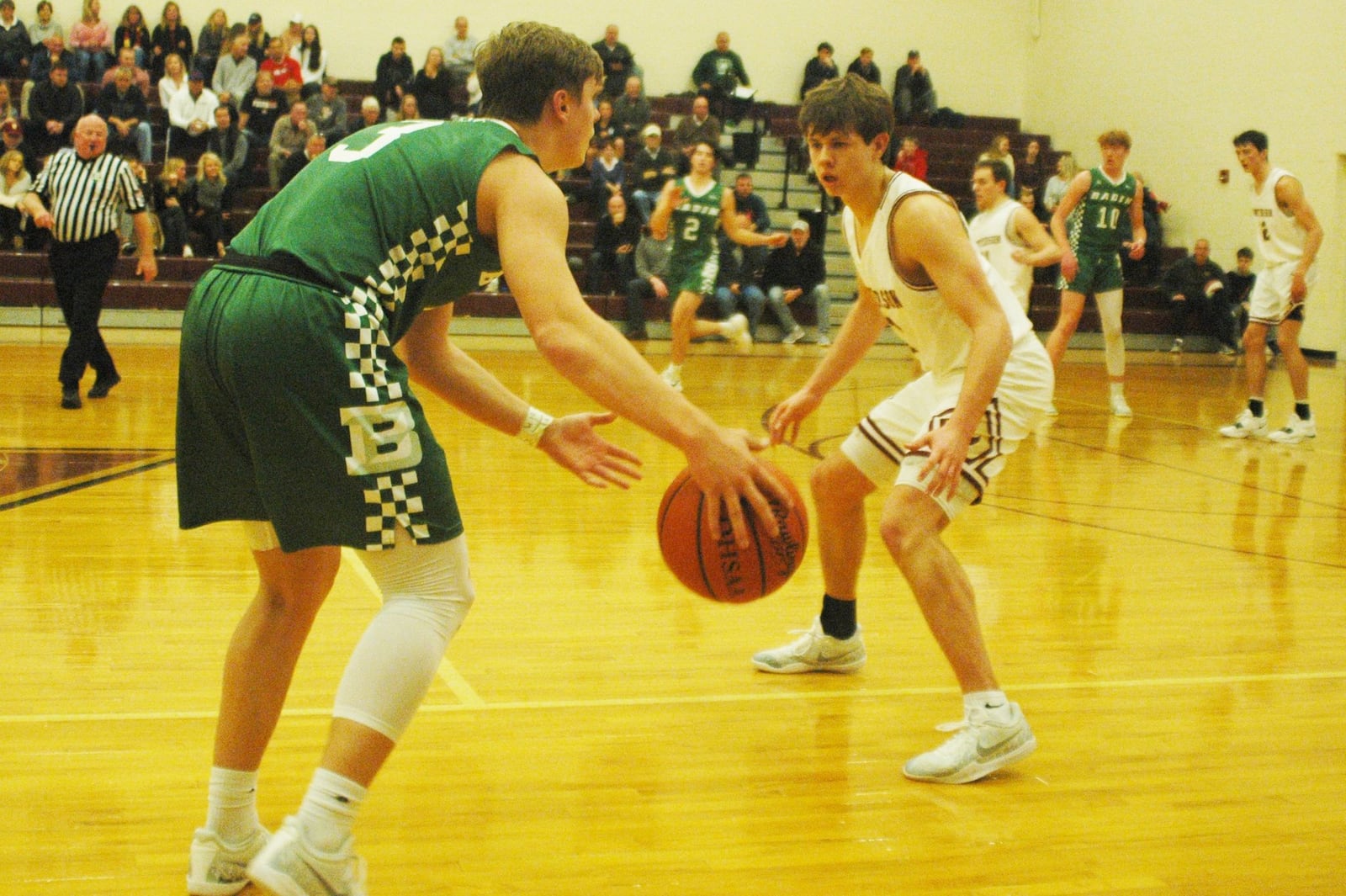 Badin’s Nathan Hegemann (3) dribbles against Columbus Watterson’s Stephen Garrett (1) during Wednesday night’s game in Columbus. Badin won 58-49. RICK CASSANO/STAFF