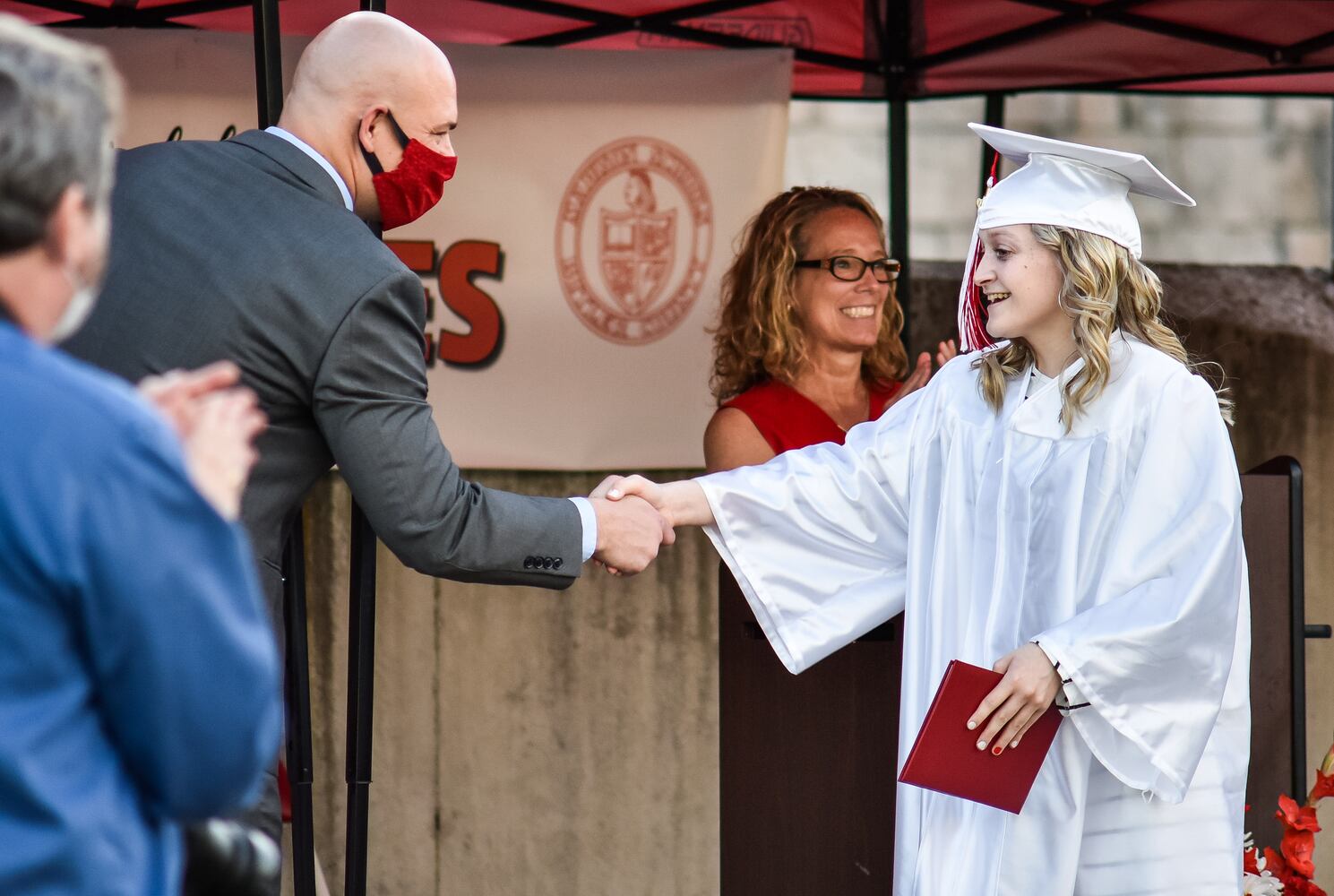 Madison High School drive-thru graduation ceremony at Land of Illusion