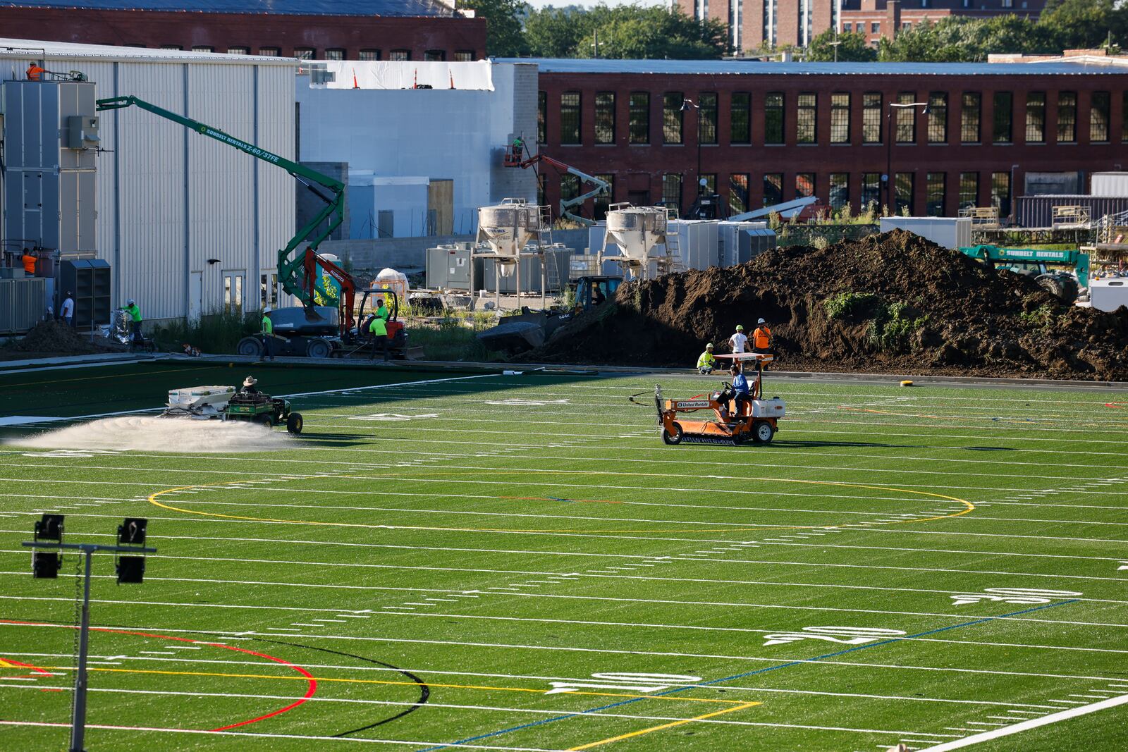 Crews work to install the turf playing field at Spooky Nook Sports Champion Mill Friday, Aug. 12, 2022 in Hamilton. NICK GRAHAM/STAFF