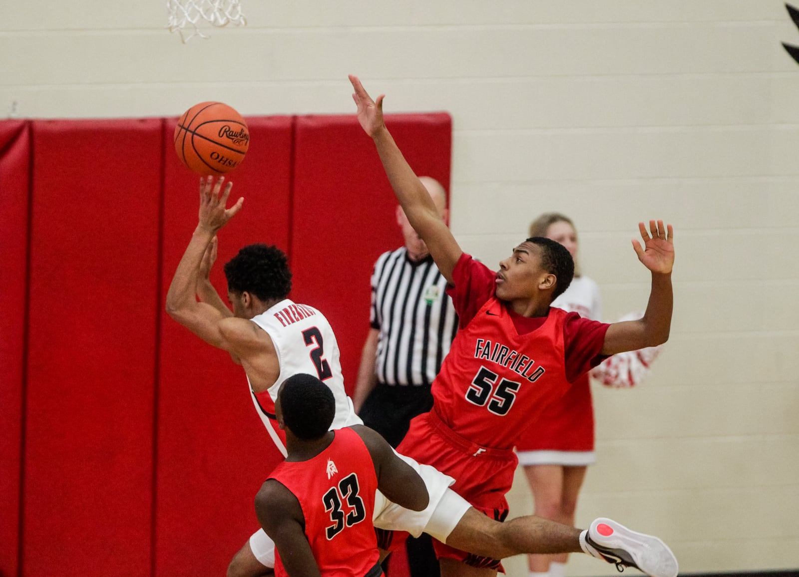 Lakota West's Kelvin Turner (2) puts up a shot defended by Fairfield's Owen Bronston during their basketball game Friday, February 12, 2021 at Lakota West High School in West Chester Township. Fairfield won 81-76. NICK GRAHAM / STAFF