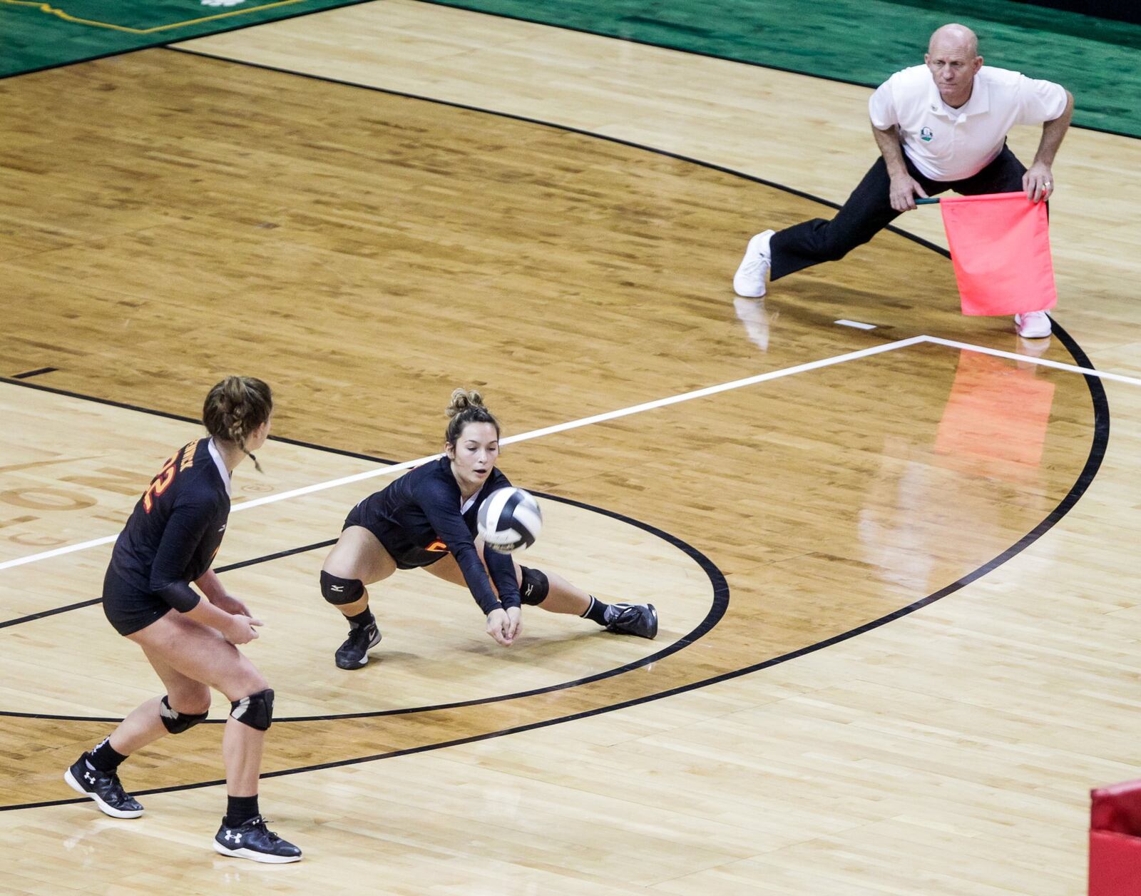 Fenwick’s Brooklyn Brunner digs for the ball during Friday’s Division II state volleyball semifinal against Parma Heights Holy Name at Wright State University’s Nutter Center. NICK GRAHAM/STAFF