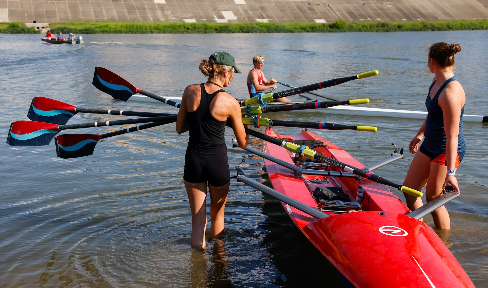 Annalie Duncomb, 16, from Mason, left, and Annelise Hahl, 16, from North Carolina, get ready for practice Thursday, Aug. 25, 2022 in Hamilton. Duncomb, Hahl and others with The Great Miami Rowing Club are heading to Wales where they will be training for and then competing in the 2022 World Coastal Championships and Beach Sprint Finals. NICK GRAHAM/STAFF