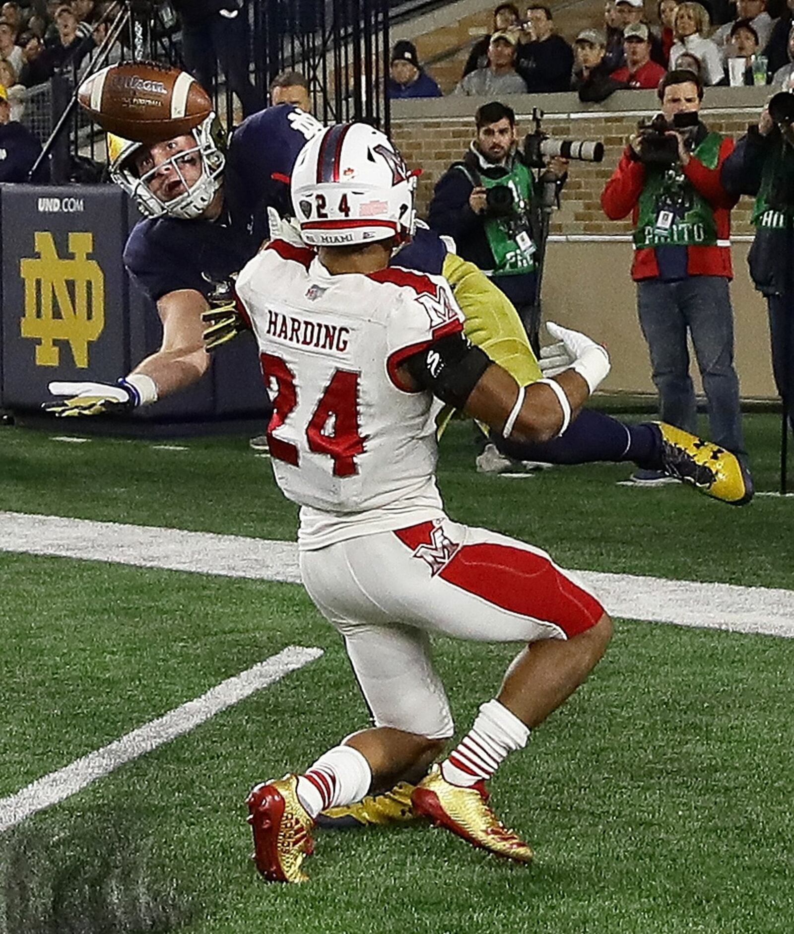 Notre Dame tight end Nic Weishar (82) tries to catch a pass in the end zone as Miami’s Heath Harding defends Saturday night during the host Fighting Irish’s 52-17 victory at Notre Dame Stadium in Notre Dame, Ind. JONATHAN DANIEL/GETTY IMAGES