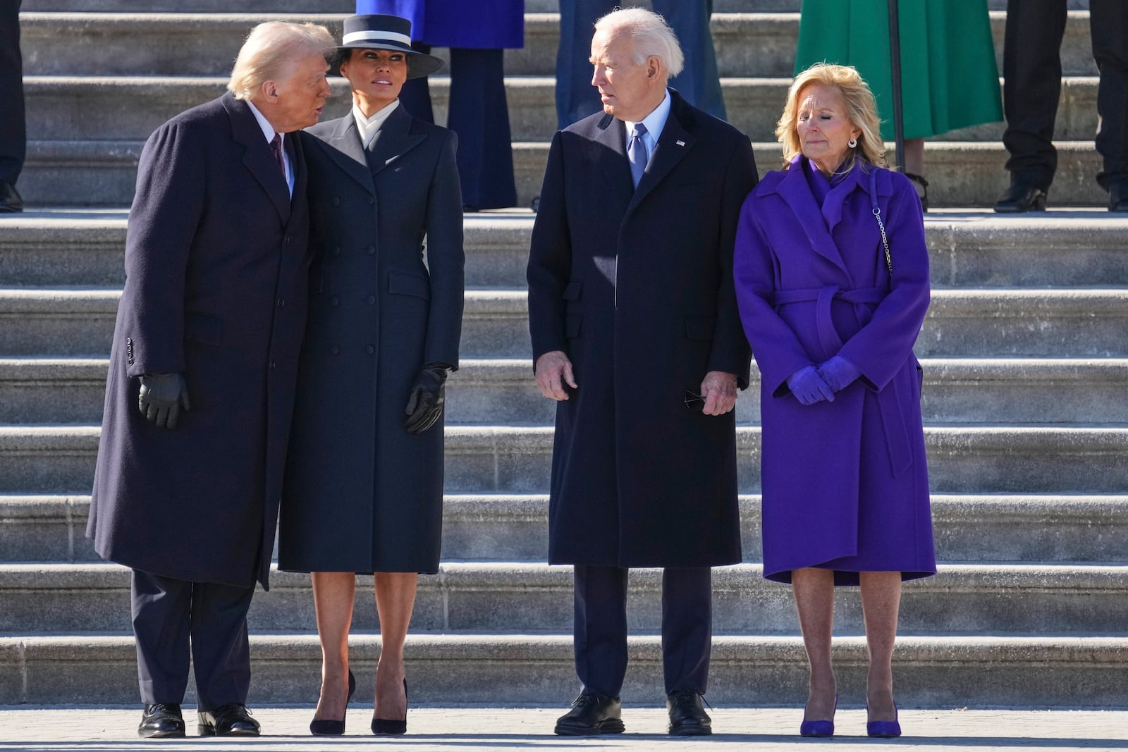 President Donald Trump, left, and first lady Melania Trump, second from left, speak with former President Joe Biden, second from right, and Jill Biden before the Bidens board a Marine helicopter to depart to Joint Base Andrews after the 60th Presidential Inauguration, Monday, Jan. 20, 2025, at the U.S. Capitol in Washington. (Chris Kleponis/Pool Photo via AP)