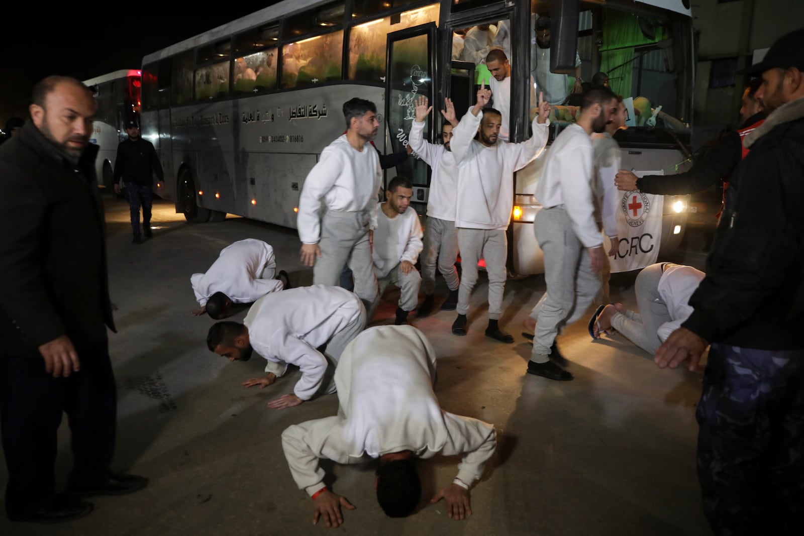 Freed Palestinian prisoners react as they arrive in the Gaza Strip after being released from an Israeli prison following a ceasefire agreement between Hamas and Israel in Khan Younis, Gaza Strip, Thursday, Feb. 27, 2025. (AP Photo/Jehad Alshrafi)