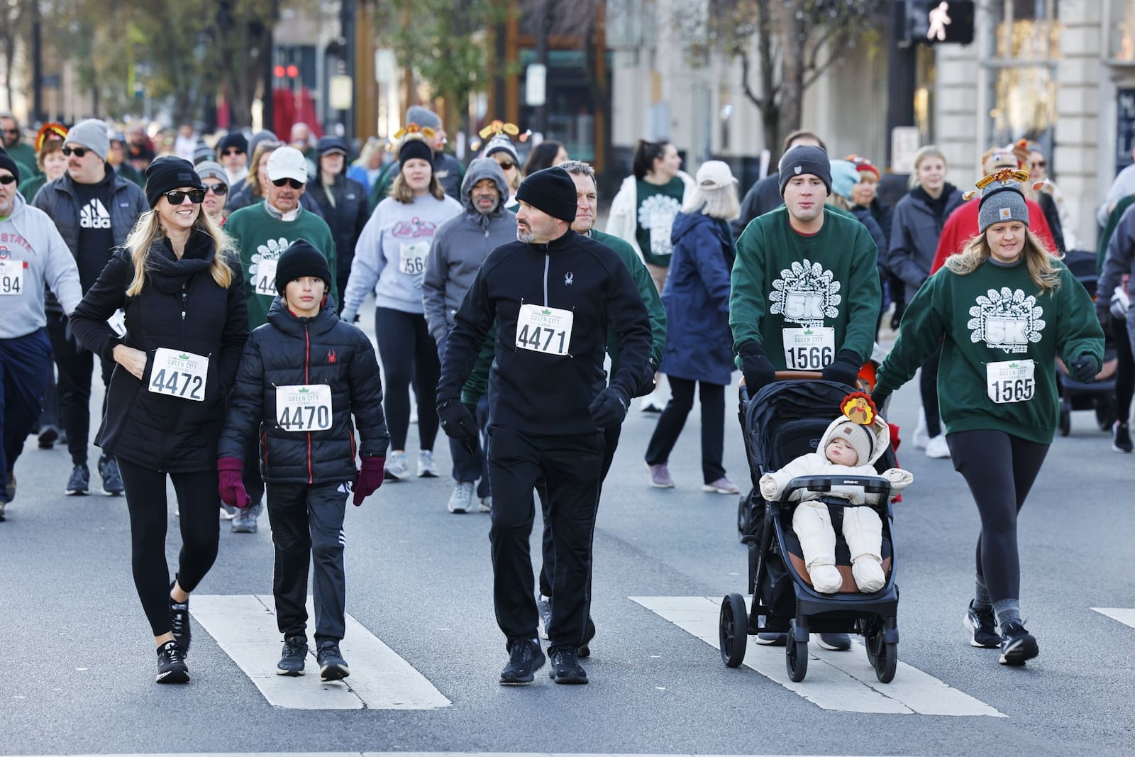 The Meyer Brothers and Sons Thanksgiving Day 5k for Young Lives was held Thursday, Nov. 24, 2022 in Hamilton. Thousands of runners, walkers and volunteers filled Marcum Park and downtown streets for the event. NICK GRAHAM/STAFF