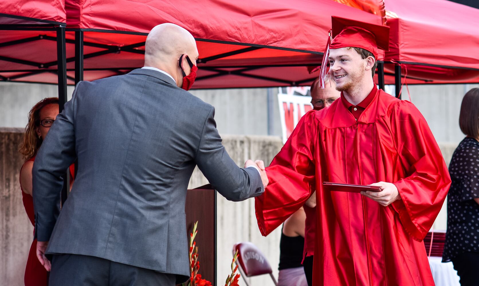 Madison High School drive-thru graduation ceremony at Land of Illusion