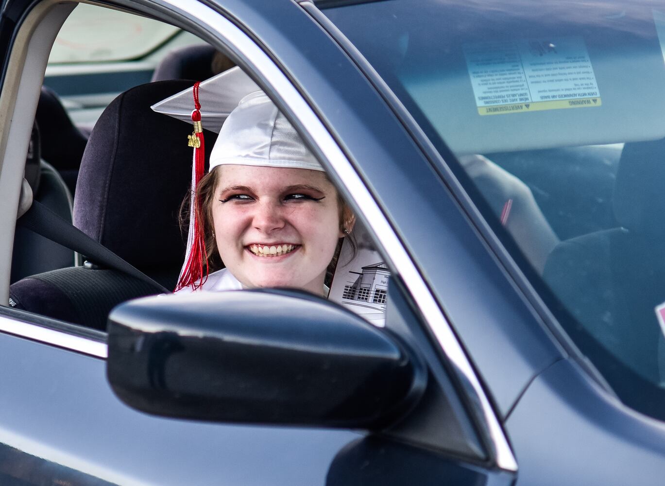 Madison High School drive-thru graduation ceremony at Land of Illusion