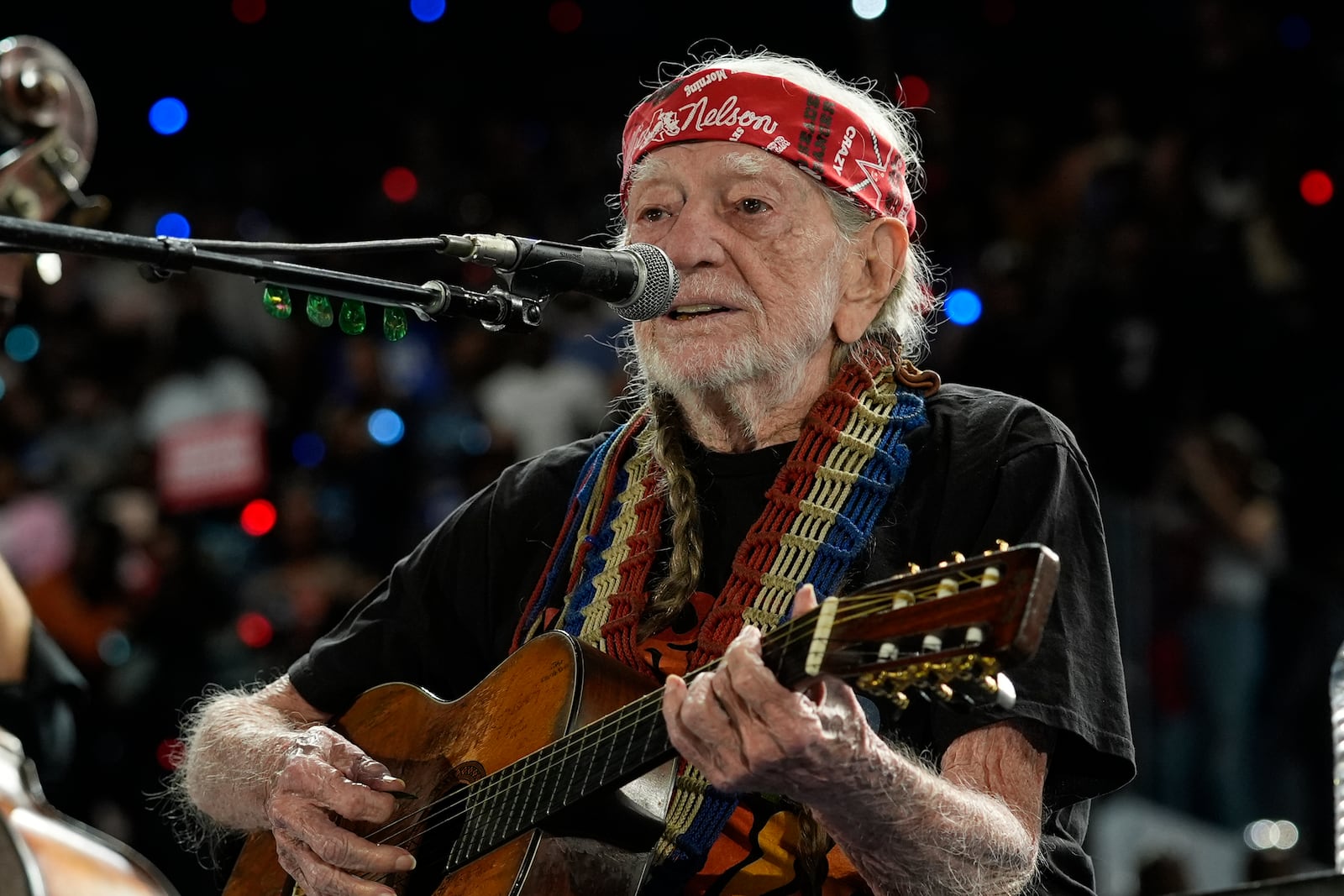 Musician Willie Nelson performing ahead of event for Democratic presidential nominee Vice President Kamala Harris at a rally in Houston, Friday, Oct. 25, 2024. (AP Photo/Susan Walsh)