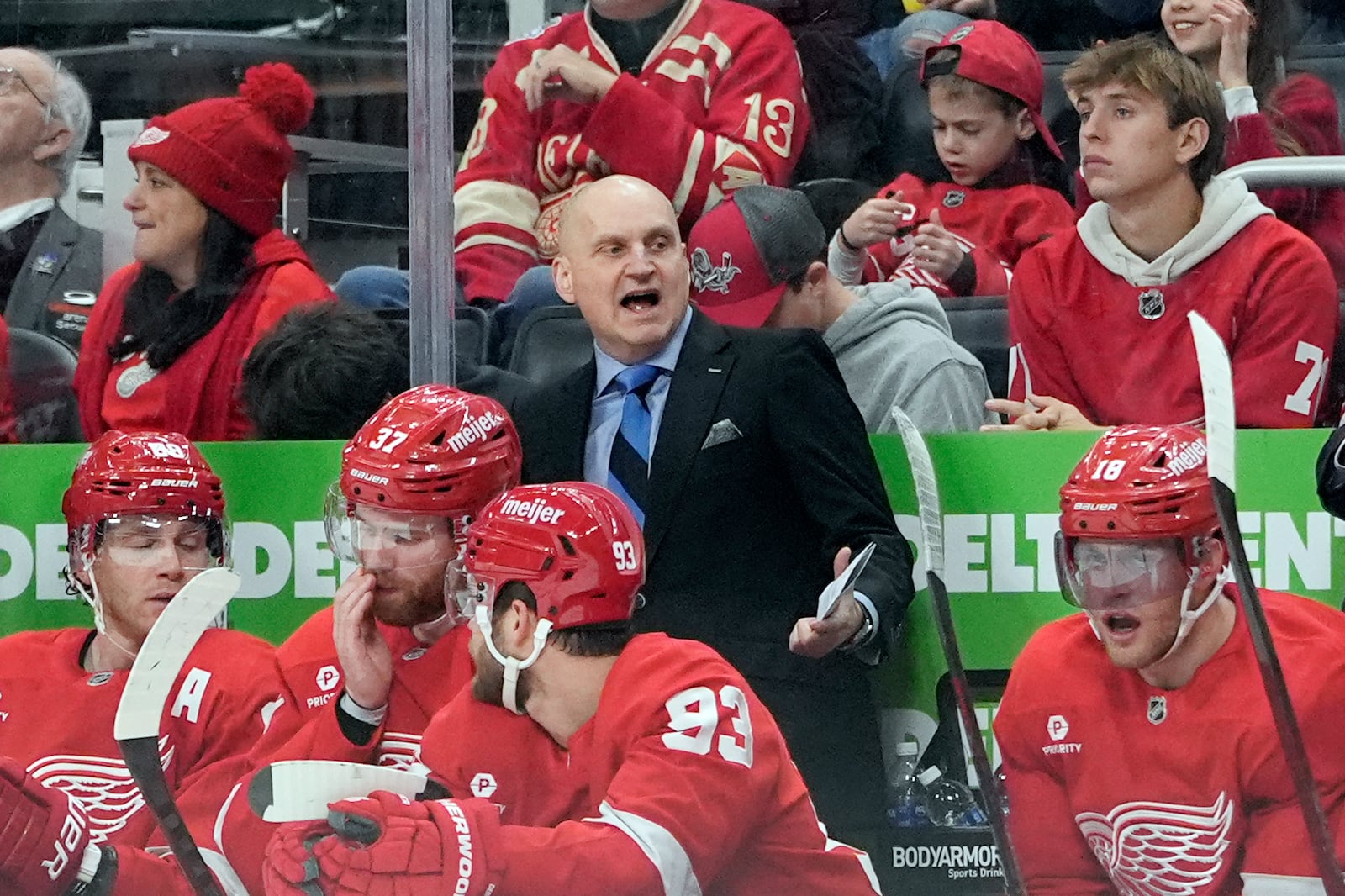 Detroit Red Wings head coach Derek Lalonde talks to his players during the second period of an NHL hockey game against the Montreal Canadiens, Friday, Dec. 20, 2024, in Detroit. (AP Photo/Carlos Osorio)