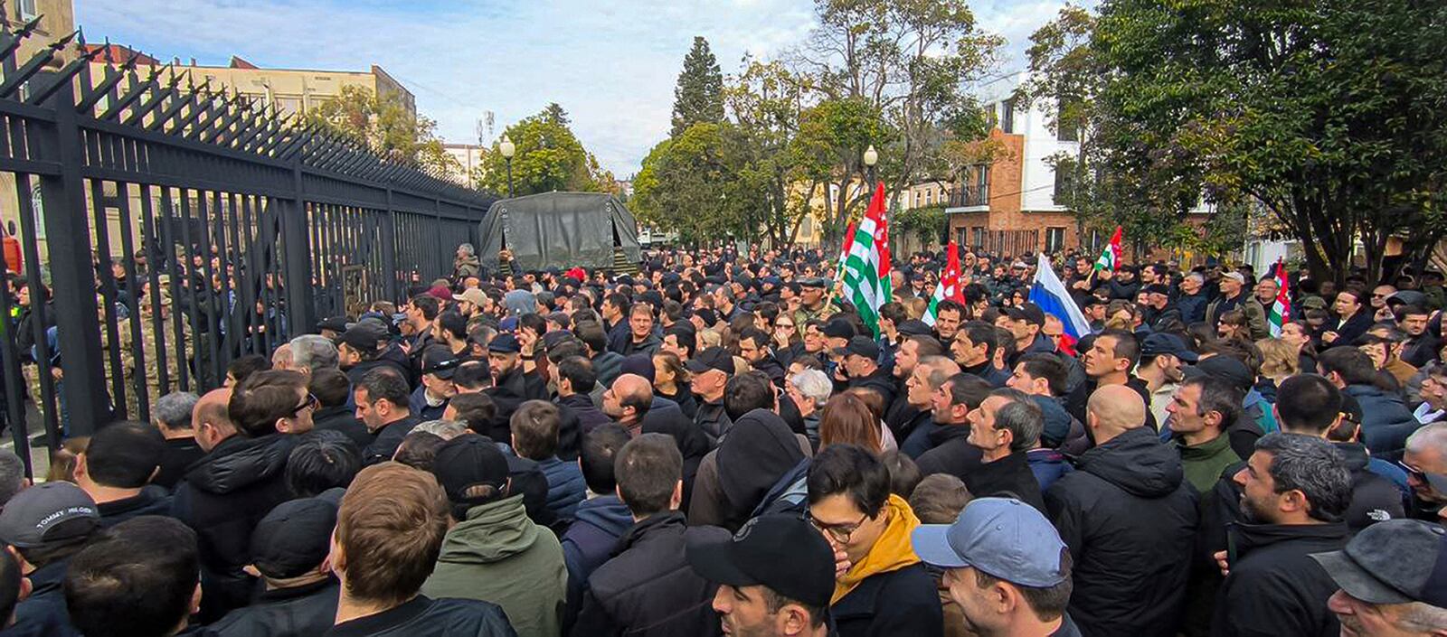 In this photo taken from video released by AIASHARA Independent Agency, Protesters gather outside the parliament building of the Georgian separatist region of Abkhazia as tensions flared over a proposed pact that would allow Russians to buy apartments in the region, Georgia, on Friday, Nov. 15, 2024. (AIASHARA Independent Agency via AP)