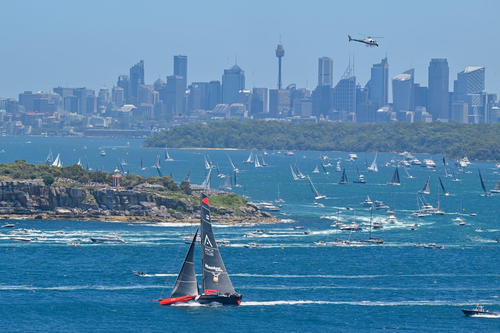 Master Lock Comanche sails out of the heads soon after the start of the Sydney to Hobart yacht race in Sydney Harbour, Thursday, Dec. 26, 2024. (Mick Tsikas/AAP Image via AP).