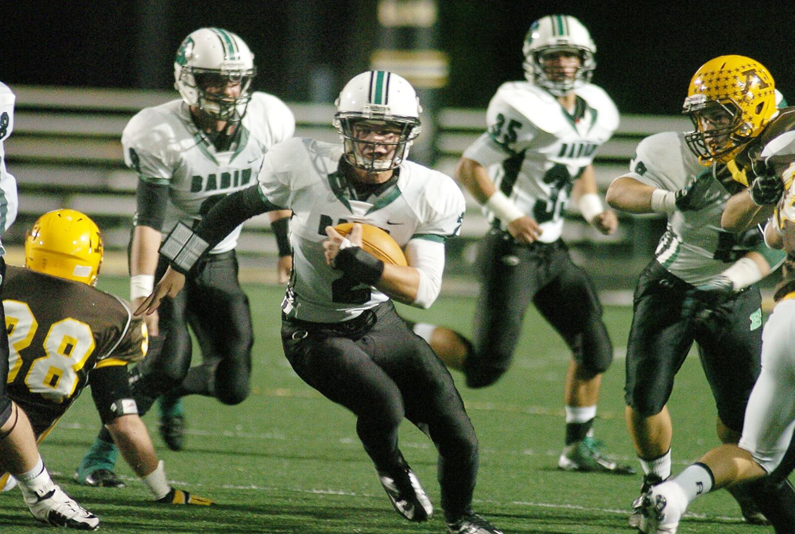 Badin’s Austin Rieman (2) looks for space to run through Alter’s defensive line during a Sept. 28, 2012 game at Centerville Stadium. COX MEDIA FILE PHOTO