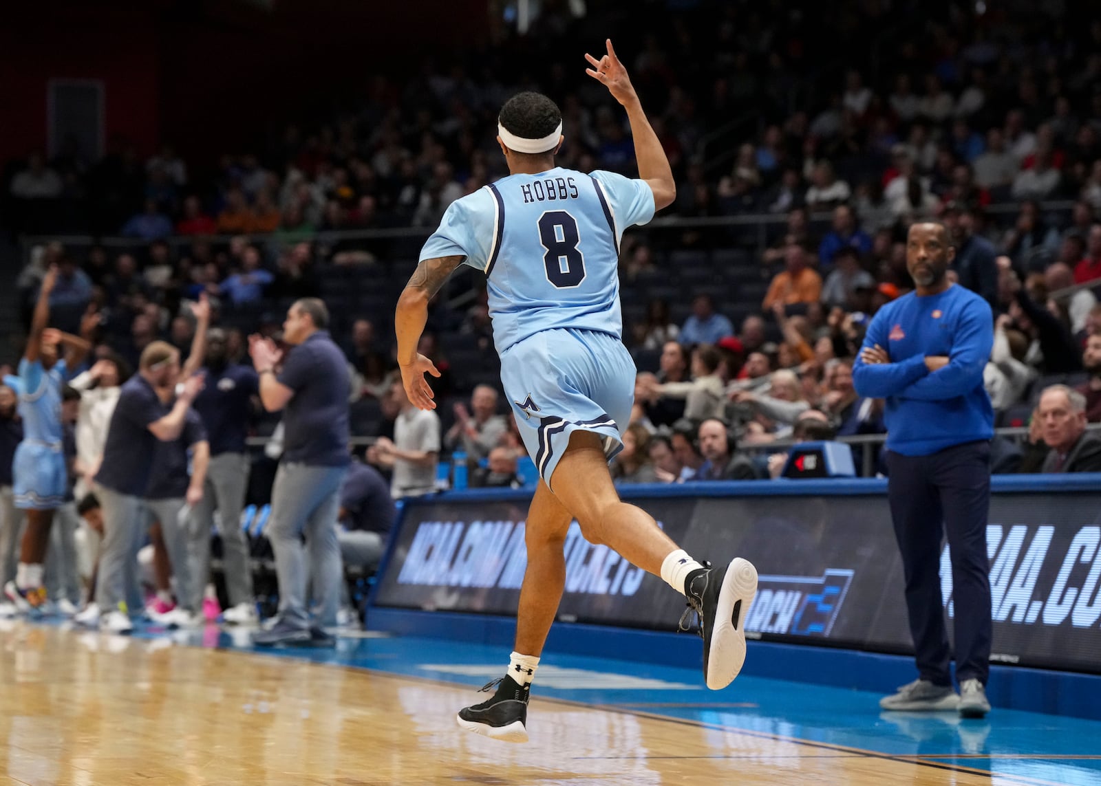 Mount St. Mary's guard Dallas Hobbs (8) reacts after scoring during the first half of a First Four college basketball game against American University in the NCAA Tournament, Wednesday, March 19, 2025, in Dayton, Ohio. (AP Photo/Jeff Dean)