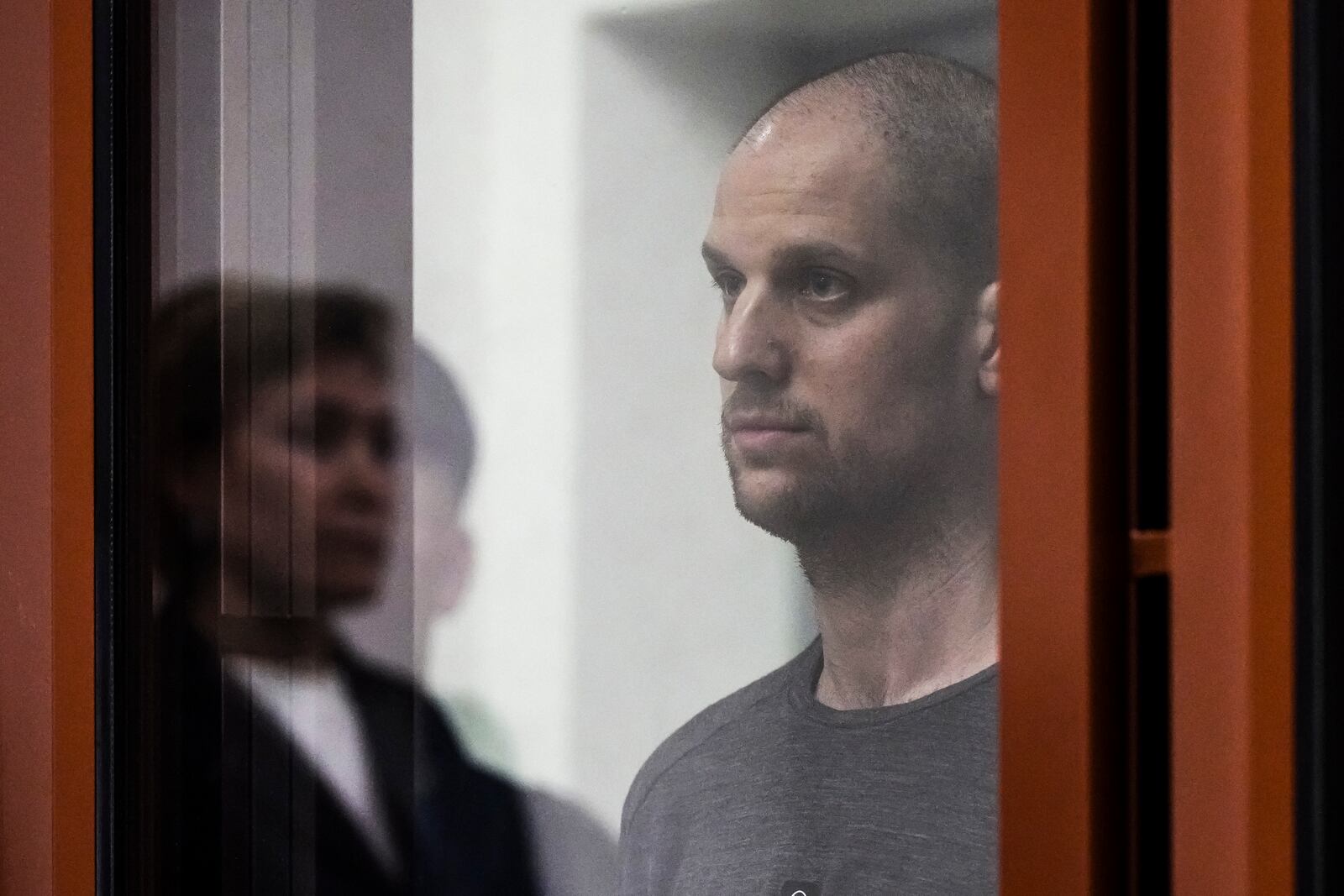 FILE - Wall Street Journal reporter Evan Gershkovich listens to the verdict against him in a glass cage in a courtroom in Yekaterinburg, Russia, on July 19, 2024. (AP Photo/Dmitri Lovetsky, File)