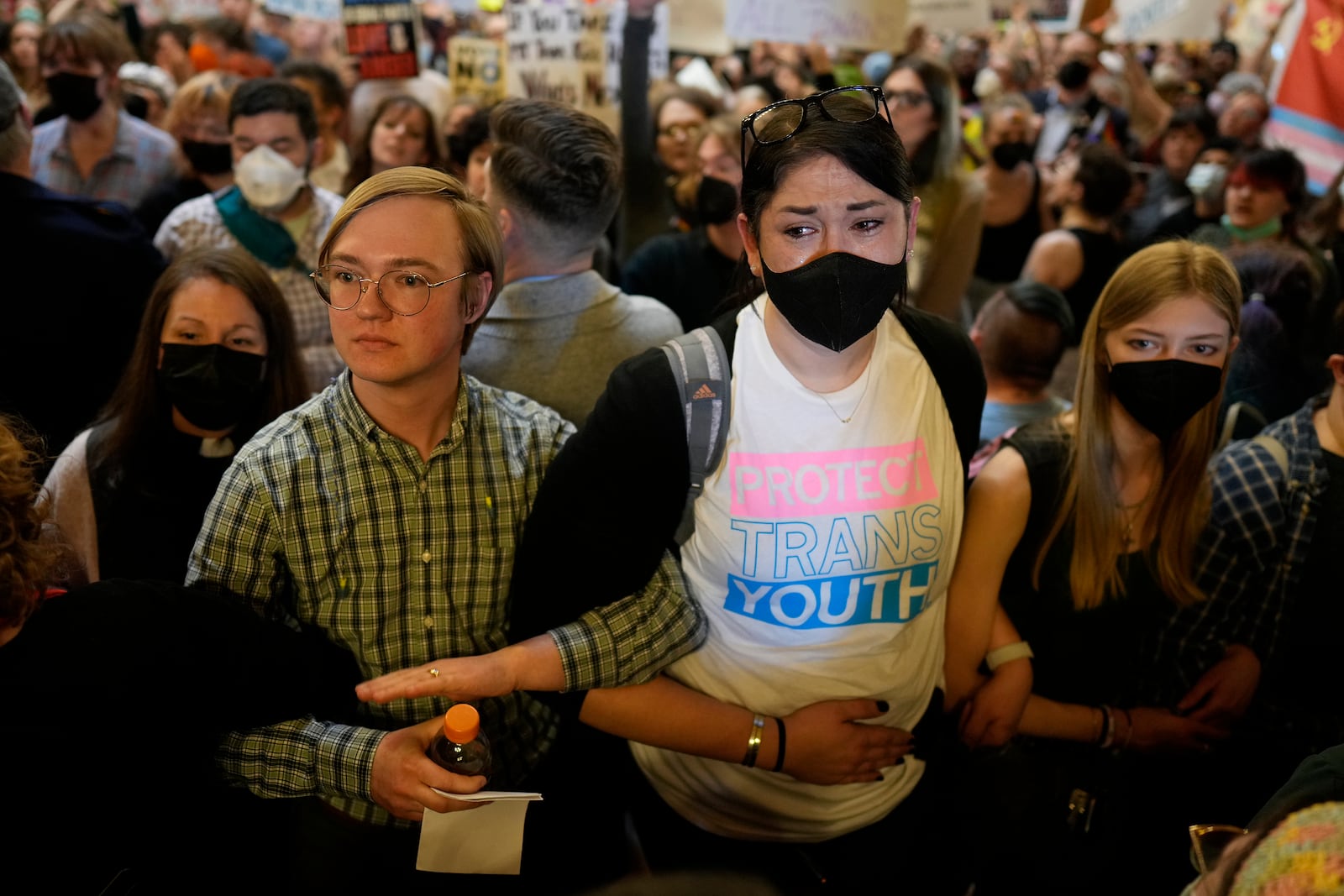 Protesters fill the Iowa state Capitol to denounce a bill that would strip the state civil rights code of protections based on gender identity, Thursday, Feb. 27, 2025, in Des Moines, Iowa. (AP Photo/Charlie Neibergall)