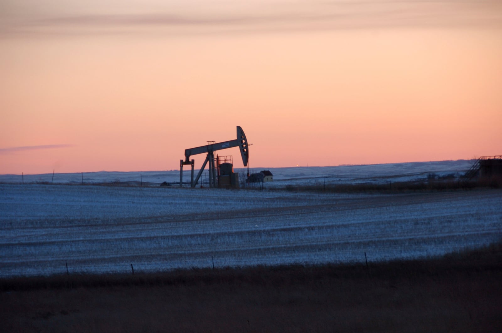 FILE - A pump jack for pulling oil from the ground is seen near New Town, N.D., Feb. 25, 2015. (AP Photo/Matthew Brown, File)