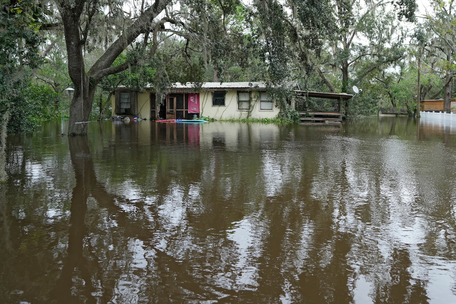 A flooded home, from the effects of Hurricane Milton is shown along the Alafia river Friday, Oct. 11, 2024, in Lithia, Fla. (AP Photo/Chris O'Meara)