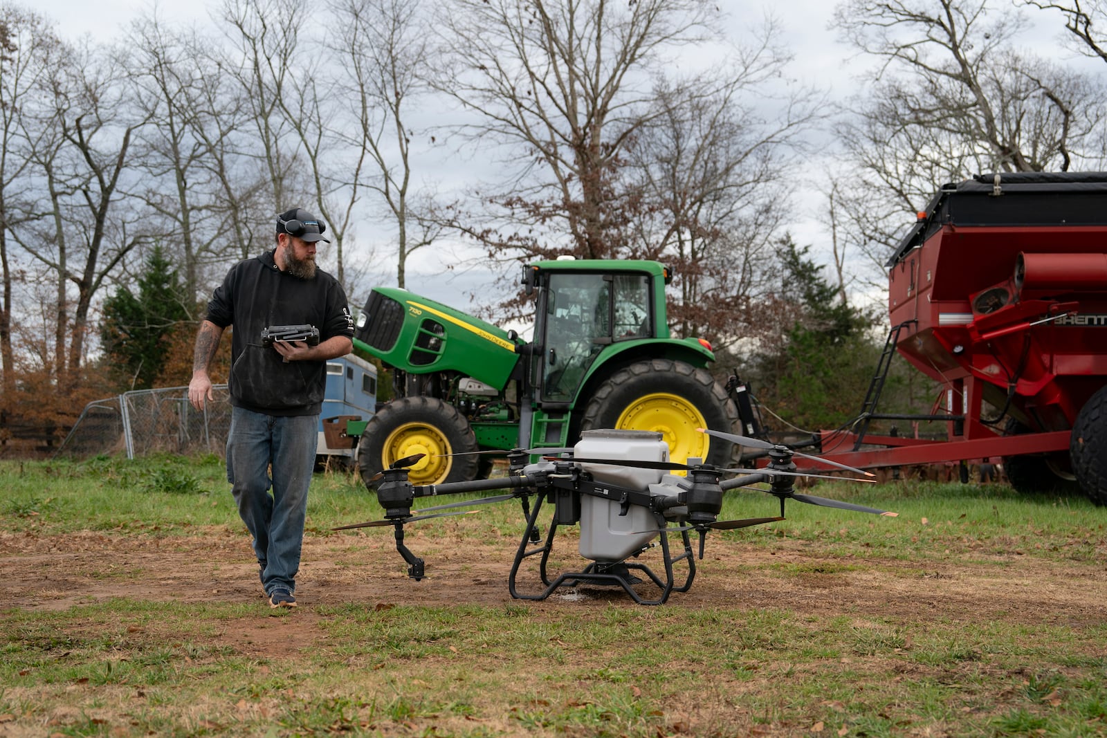 Russell Hedrick prepares a DJI drone to put crop cover on his farm, Tuesday, Dec. 17, 2024, in Hickory, N.C. (AP Photo/Allison Joyce)