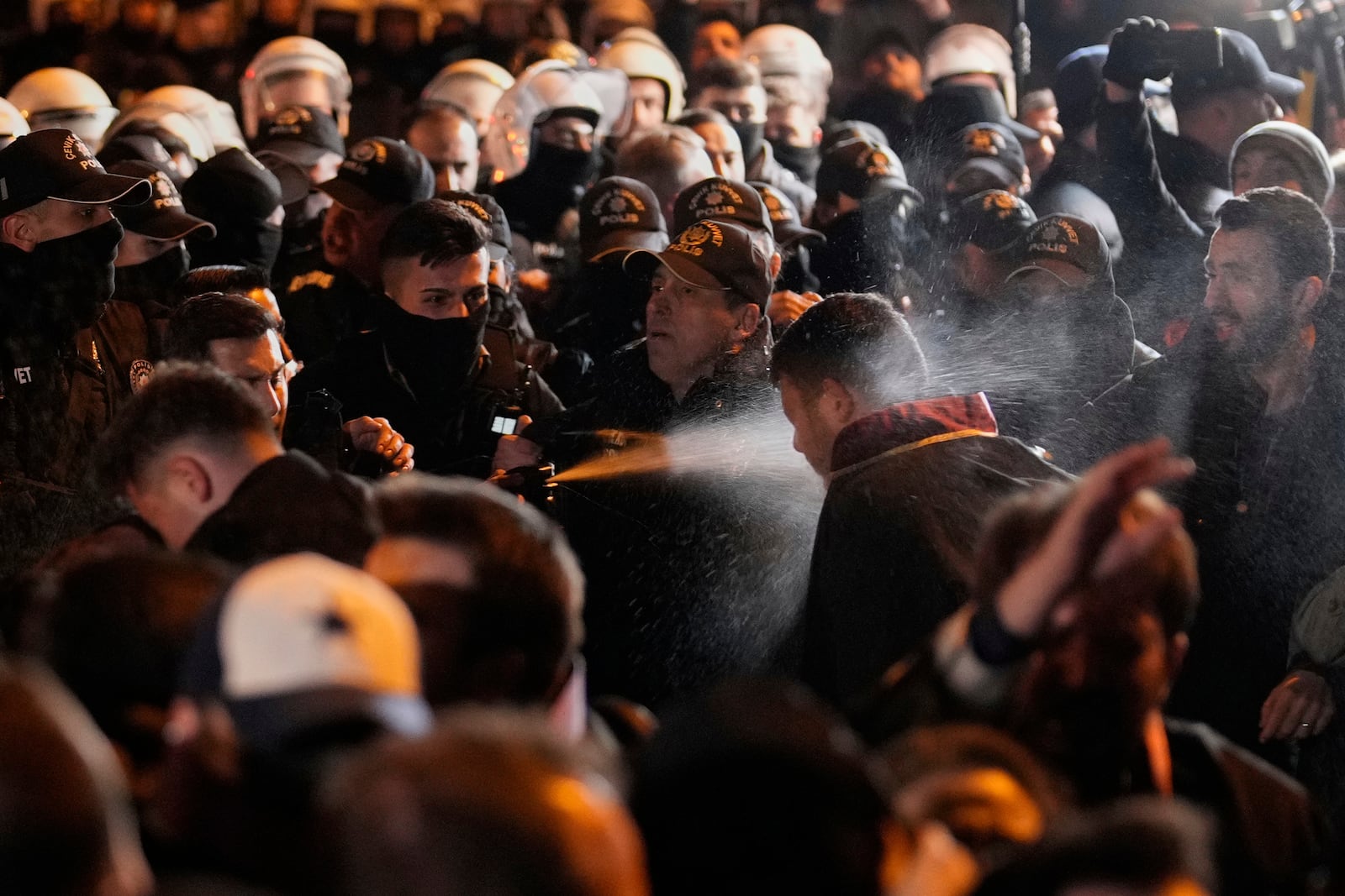 Anti riot police officers use tear gas to clear protesters during a protest against the arrest of Istanbul's Mayor Ekrem Imamoglu, outside Caglayan courthouse, in Istanbul, Turkey, Saturday, March 22, 2025. (AP Photo/Emrah Gurel)