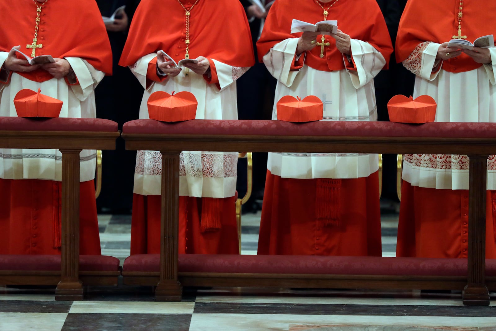 FILE-- Cardinals attend vespers with Pope Francis at St. Peter and Paul's Basilica in Rome, Wednesday, Jan. 25, 2017. (AP Photo/Gregorio Borgia)