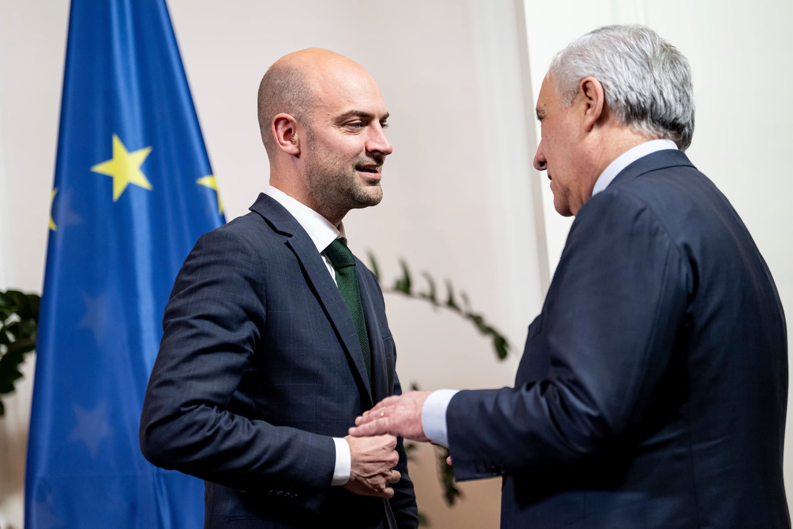 Jean-Noel Barrot, left, Foreign Minister of France, and Antonio Tajani, Foreign Minister of Italy, arrive for a family photo at the meeting of EU Foreign Ministers at the Federal Foreign Office's guest house, Villa Borsig, in Berlin, Thursday, Dec. 12, 2024. (Fabian Sommer/dpa via AP)