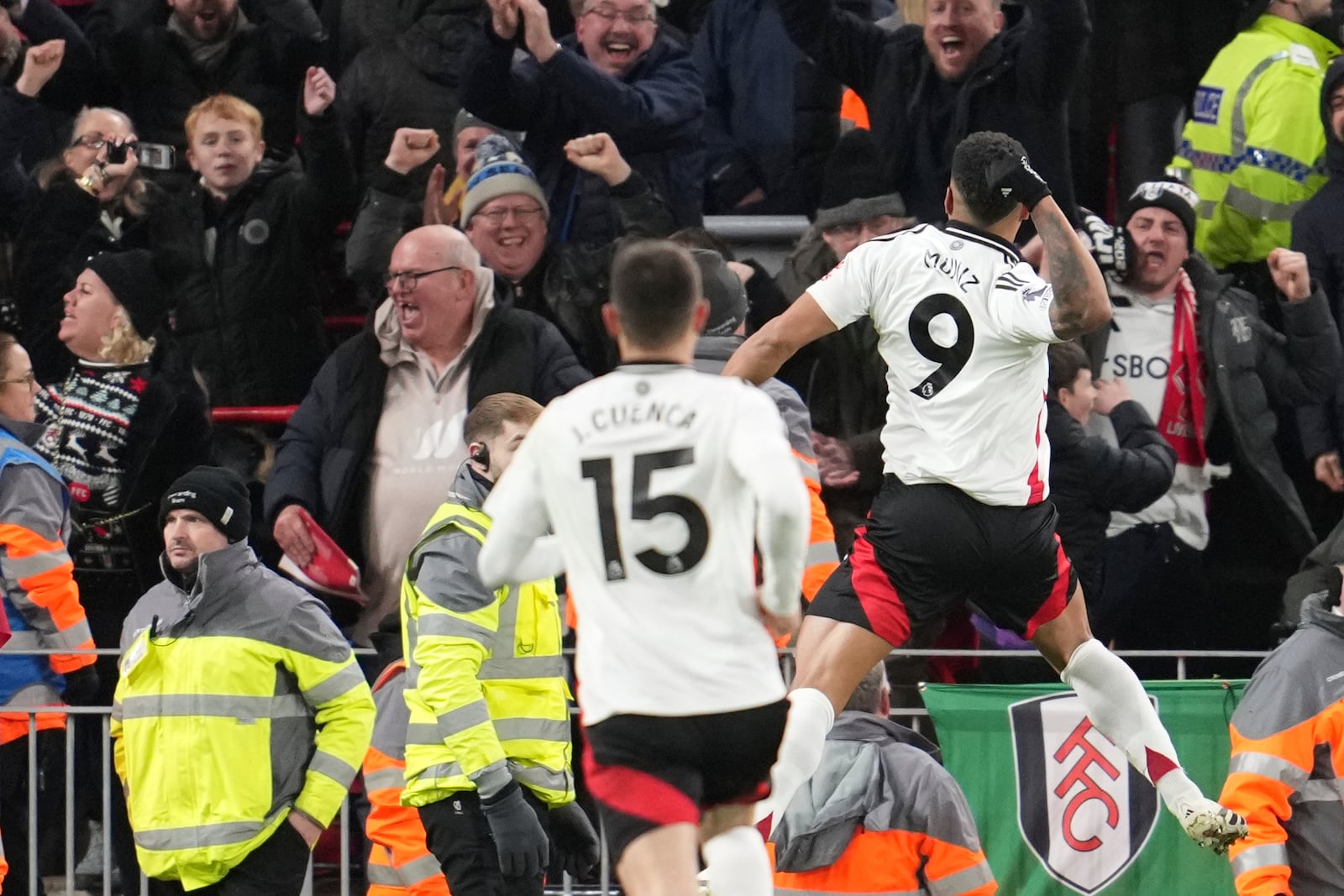 Fulham's Rodrigo Muniz, right, celebrates with teammates after scoring his side's second goal during the English Premier League soccer match between Liverpool and Fulham, at Anfield stadium in Liverpool, England, Saturday, Dec. 14, 2024. (AP Photo/Jon Super)