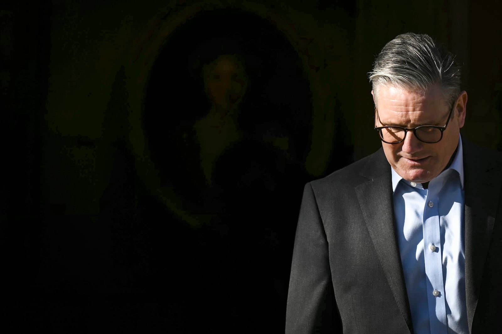 Britain's Prime Minister Keir Starmer waits for Germany's Chancellor Olaf Scholz to arrive at the Chequers, in Aylesbury, England, Sunday, Feb. 2, 2025. (Ben Stansall/Pool Photo via AP)