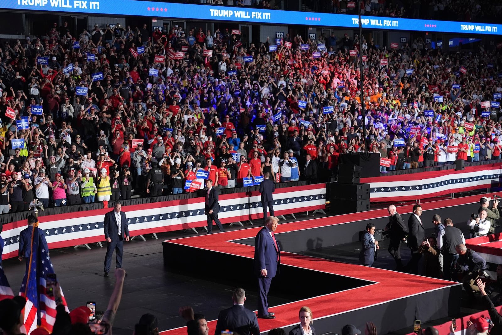 Republican presidential nominee former President Donald Trump arrives at a campaign rally at Van Andel Arena, Tuesday, Nov. 5, 2024, in Grand Rapids, Mich. (AP Photo/Paul Sancya)