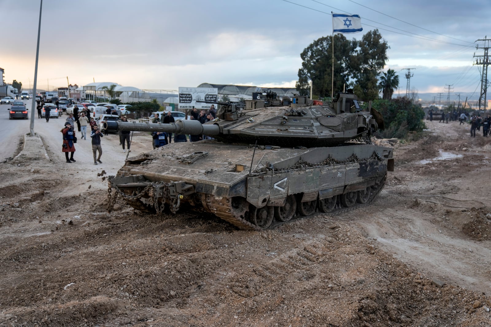 Israeli tanks move into the Palestinians city of Jenin in the occupied West Bank, Sunday, Feb. 23, 2025. (AP Photo/Majdi Mohammed)