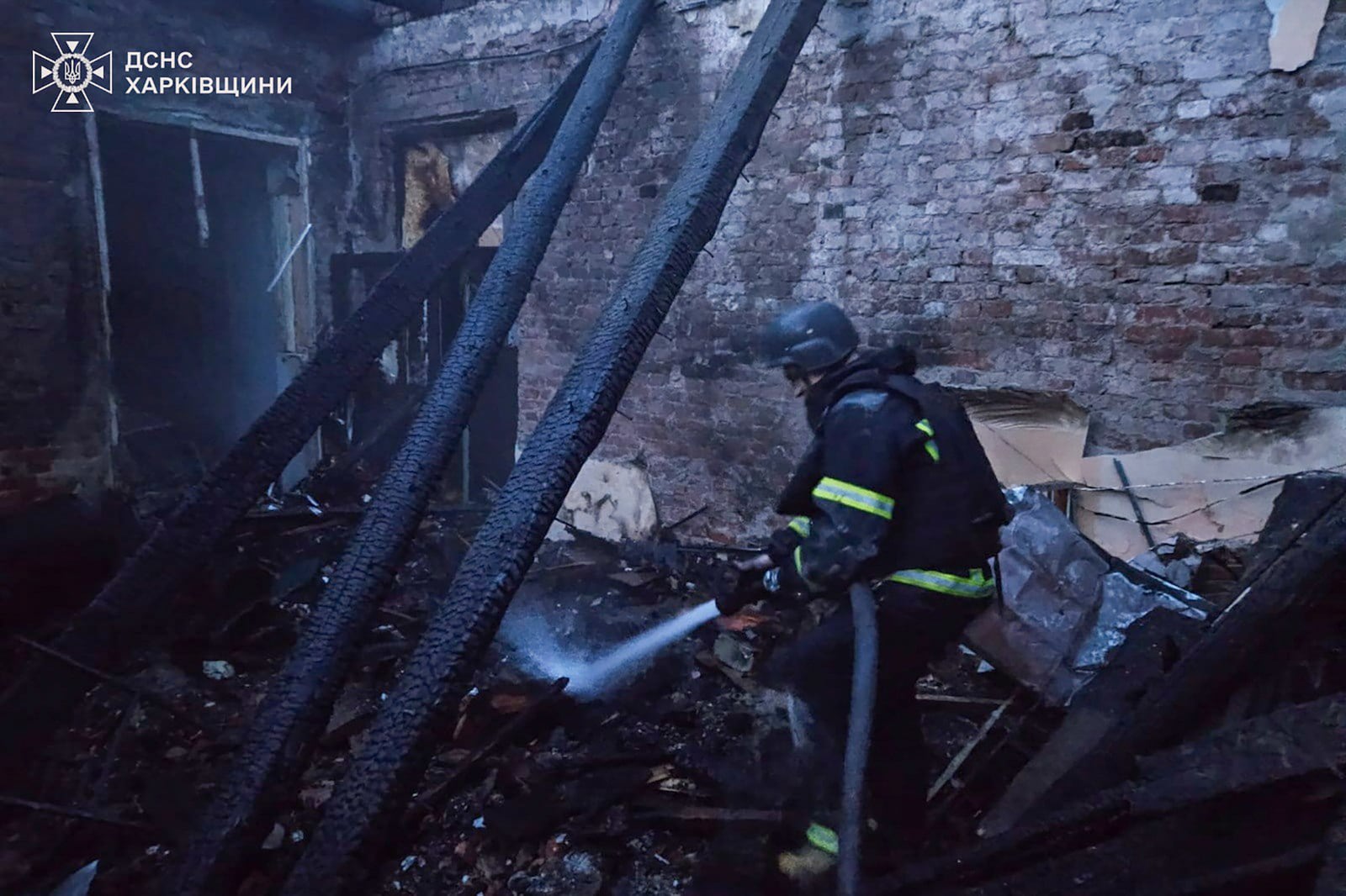 In this photo provided by the Ukrainian Emergency Service, firefighters put out the fire at a lyceum following a Russian drone attack in Bohodukhiv, Kharkiv region, Ukraine, Saturday, March 15, 2025. (Ukrainian Emergency Service via AP)