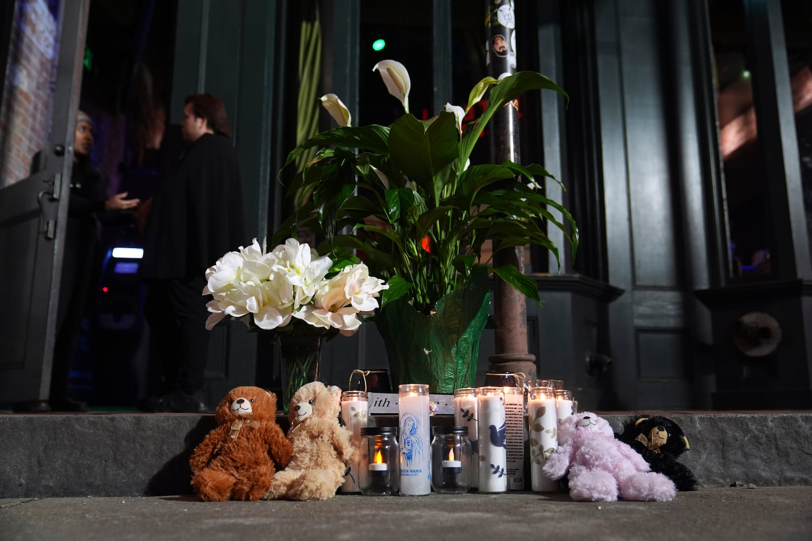 A memorial sits outside a restaurant along Bourbon Street in the French Quarter, Thursday, Jan. 2, 2025 in New Orleans. (AP Photo/George Walker IV)