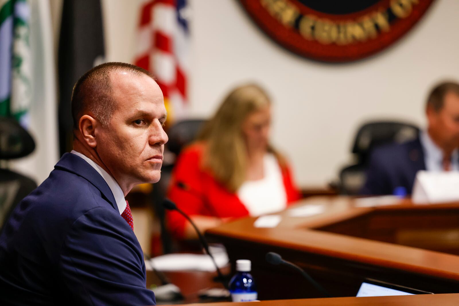 New Hamilton city manager Craig Bucheit looks at the crowd during a special Hamilton city council meeting to discuss the Miami Conservancy District assessment increase with a presentation by Miami Conservancy District staff Thursday, April 18, 2024 in Hamilton. NICK GRAHAM/STAFF