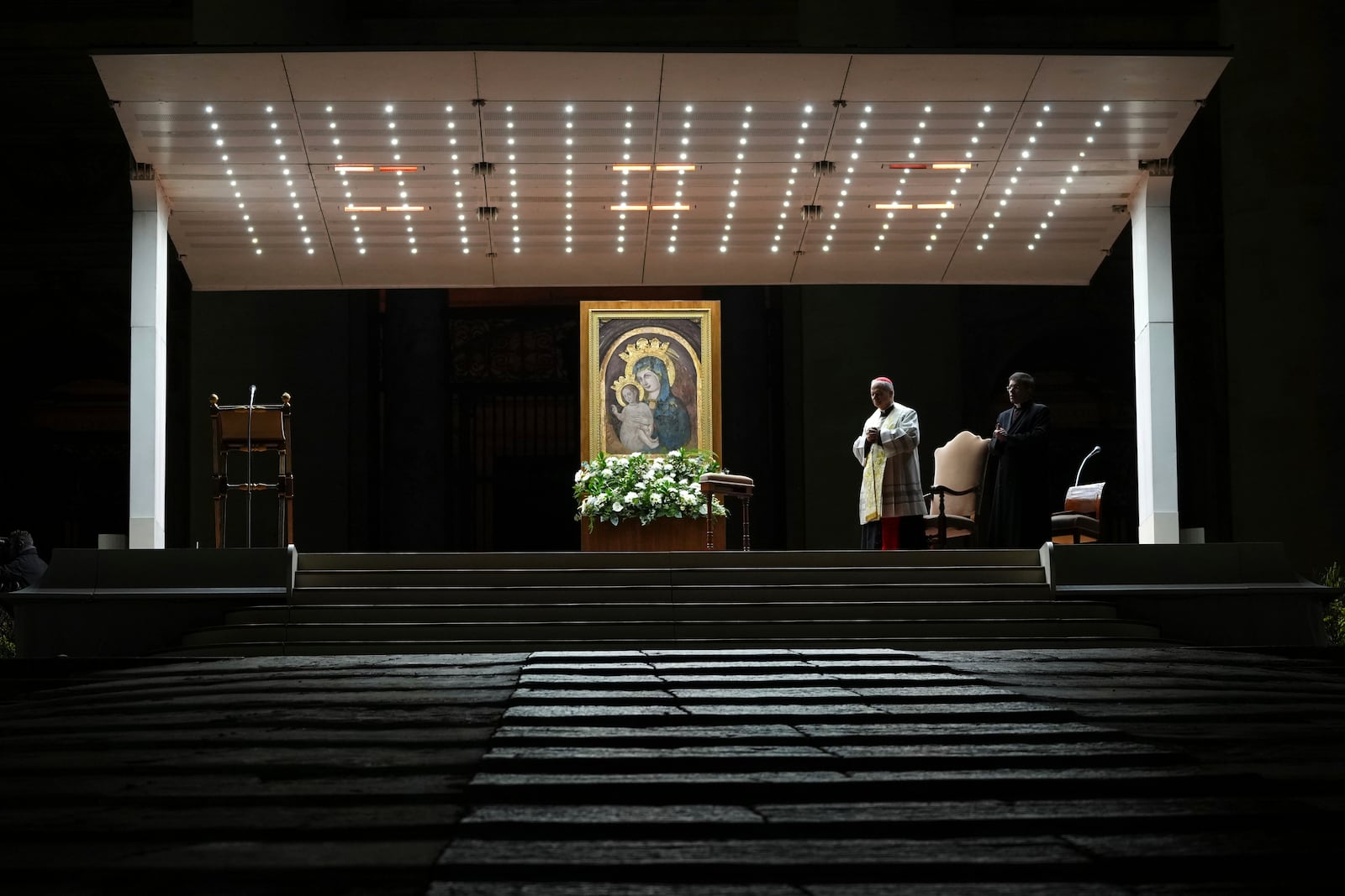 Cardinal Robert Francis Prevost, Prefect of the Dicastery for Bishops, leads the recitation of the Holy Rosary for Pope Francis' health in St Peter's Square at the Vatican, Monday, March 3, 2025. (AP Photo/Kirsty Wigglesworth)