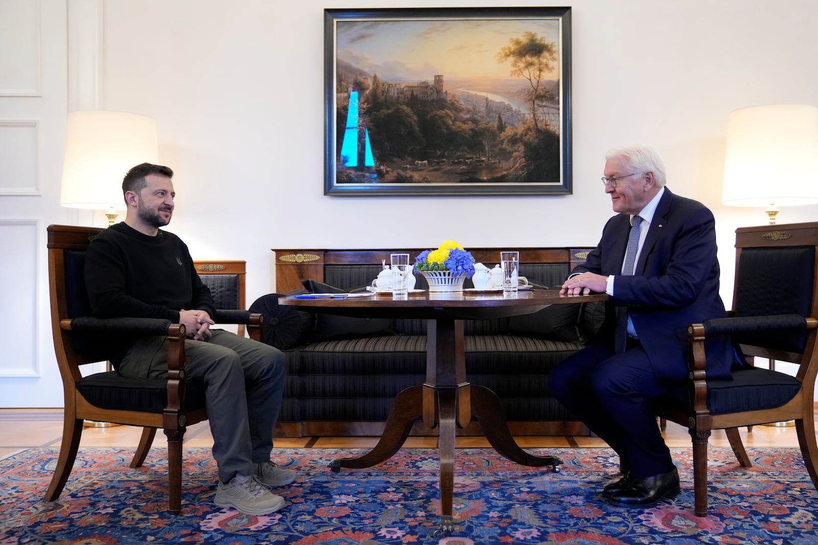 Ukraine's president Volodymyr Zelenskyy sits at a table with German president Frank-Walter Steinmeier before a private conversation at Schloss Bellevue in Berlin, Germany, Friday, Oct. 11, 2024. (AP Photo/Ebrahim Noroozi, Pool)