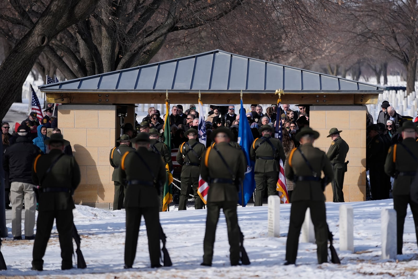 U.S. Border Patrol agent David Maland is recognized with military honors before his burial at Fort Snelling National Cemetery in Minneapolis, on Saturday, Feb. 22, 2025. (AP Photo/Abbie Parr)