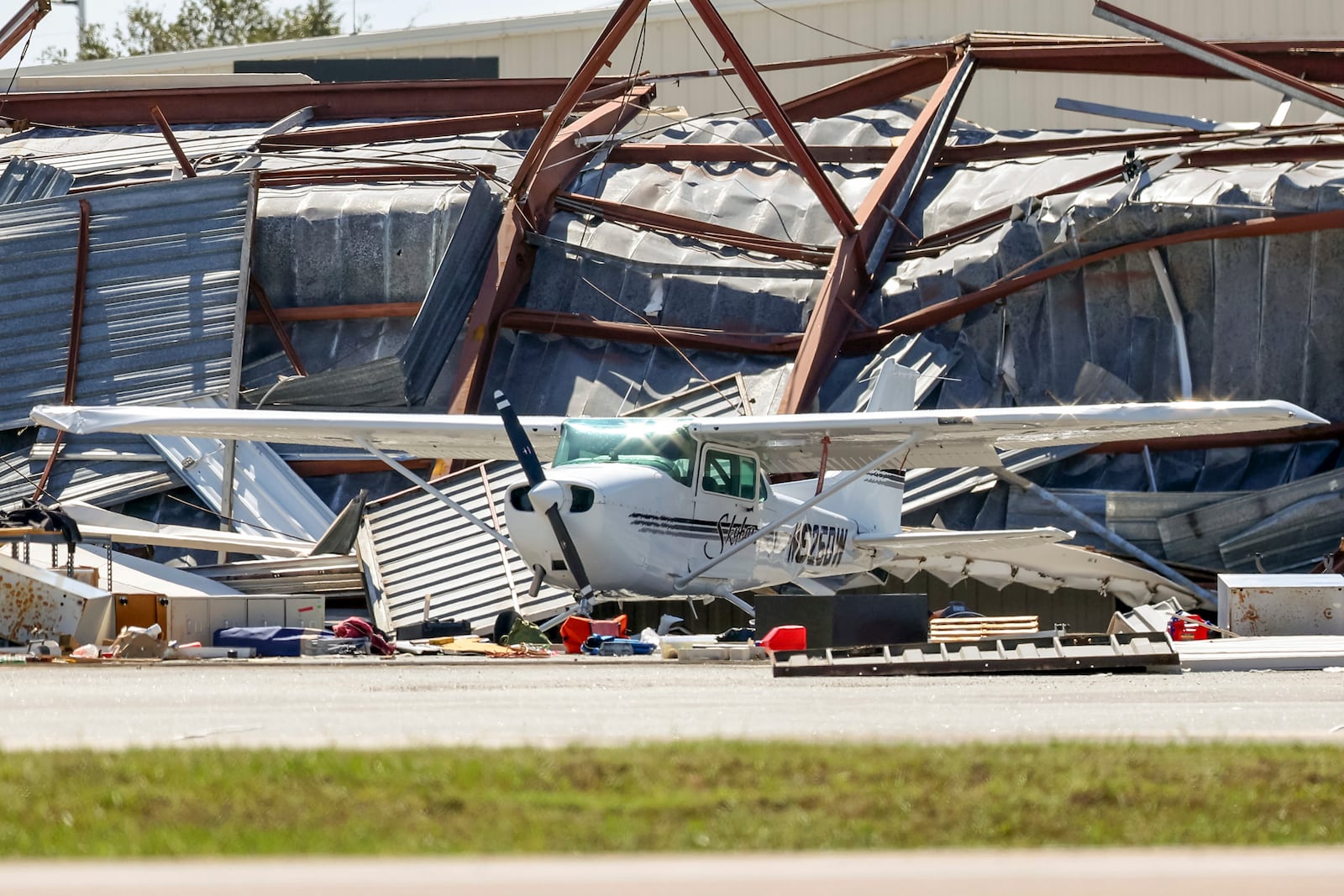 Hangars at Albert Whitted Airport were damaged by winds from Hurricane Milton on Thursday, Oct. 10, 2024, in St. Petersburg, Fla. (AP Photo/Mike Carlson)